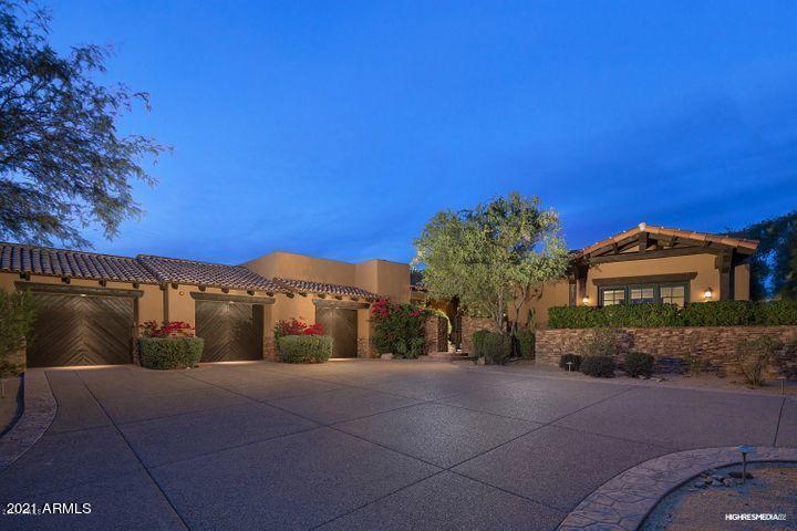 Stunning updated custom home on a private 1.25 acres in guard-gated DC Ranch community. This home's special features include 2 split master suites, gorgeous detached 545sf Casita, huge family living space and open Kitchen with 2 dishwashers, warming drawer, Miele ovens & coffee maker and full-size Sub-Zero fridge/freezer.   Updates include premium kitchen granite, white oak floors in main living areas, bedrooms & the Casita and a fully paid for Solar Power System. There are 6 bedrooms, 6 baths plus an office and a game room; Bedrooms are en-suite.   Tremendous views of Pinnacle Peak, Troon Mountain & the McDowells from the 2nd master as well as your backyard.  Enter through the courtyard with lush landscape and enjoy a serene outdoor entertaining area. A second courtyard has cozy seating area and separate dog-run or garden.  Oversized 3 car garage with workbench, and plenty of storage.  The convenience of this home in the highly-acclaimed DC Ranch Country Club makes it a must-see property .  It's as easy as a ten-minute walk or bike ride to Golf, Gym, Pools, tennis, groceries, restaurants, boutiques and 17 miles of lighted trails all without crossing a busy road.  To top it off, you're just 25 minutes to Sky Harbor Airport, 15 minutes to Kierland and 20 mins to Old Town.  Based on prior appraisal total square footage is 6,700/owner.  Premium existing 6-year home warranty transfers to Buyer at closing.