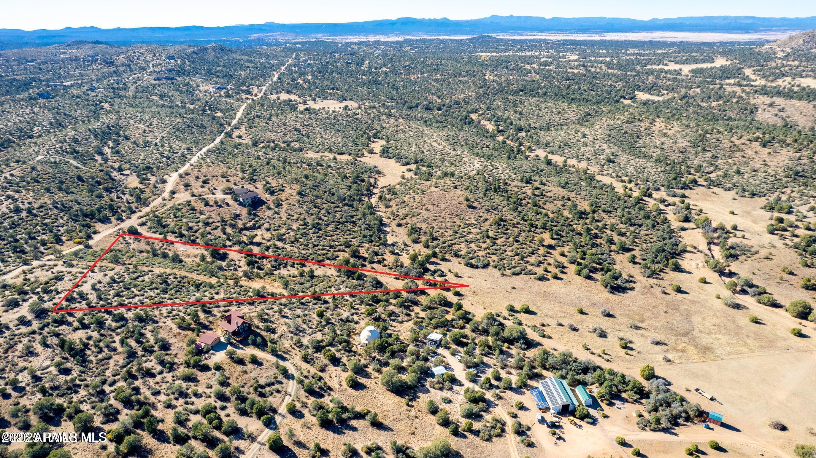 Build Your Dream Home on This Private 3-Acre Lot!
This beautifully landscaped 3-acre property offers unmatched privacy and a serene country atmosphere, just a short drive from the charm and amenities of Prescott Square. A 16-foot-wide graded driveway leads to a prepared building pad, with the flexibility to build beyond the designated pad area. The southwest corner of the lot features an APS transformer for convenient power access. Chain-link and field fencing run along the entire boundary, providing both security and definition. This is a rare opportunity to enjoy peaceful rural living without sacrificing proximity to town. Amazing views!