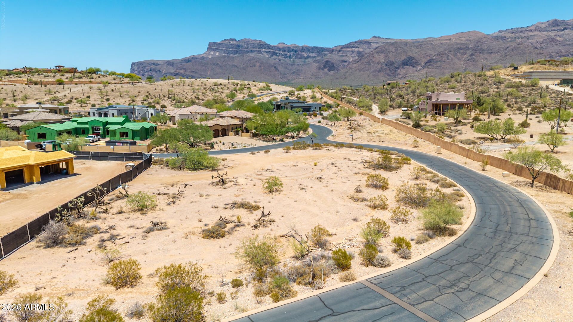 Build your dream home in the prestigious, guard-gated Superstition Mountain Golf & Country Club! This exceptional 0.74-acre homesite in the exclusive Petroglyph Estates offers breathtaking views of the Superstition Mountains, pristine Sonoran Desert, and spectacular Arizona sunsets. The level, easy-build lot is surrounded by stunning custom homes valued at $1M+ and provides the perfect setting for your luxury dream home. Enjoy 36 holes of award-winning Jack Nicklaus-designed championship golf and the unmatched lifestyle this premier Gold Canyon community has to offer. With no required timeframe to build, you have the freedom to design and build at your own pace. Optional club membership offers access to world-class amenities, including a state-of-the-art fitness center, tennis and pickleball courts, resort-style pool and spa, exceptional dining, and an active social calendar. Don't miss this rare opportunity to own one of the finest custom homesites in one of Arizona's most sought-after luxury golf communities. Membership is optional and available under a separate agreement.