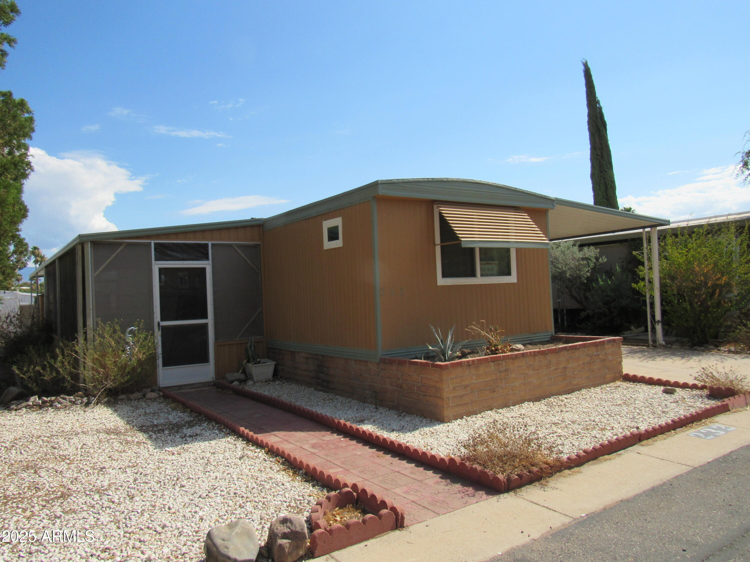 Located on a quiet street this charming home has a large yard and screened porch.
Late 2021 home was remodeled, new appliances, new windows, new floors, tape and textured walls.  New track lights and under counter lights. Drapes stay.
Awnings on all windows, 6 skylights.  Large shed at end of carport. 
Move in care-free. 
55+