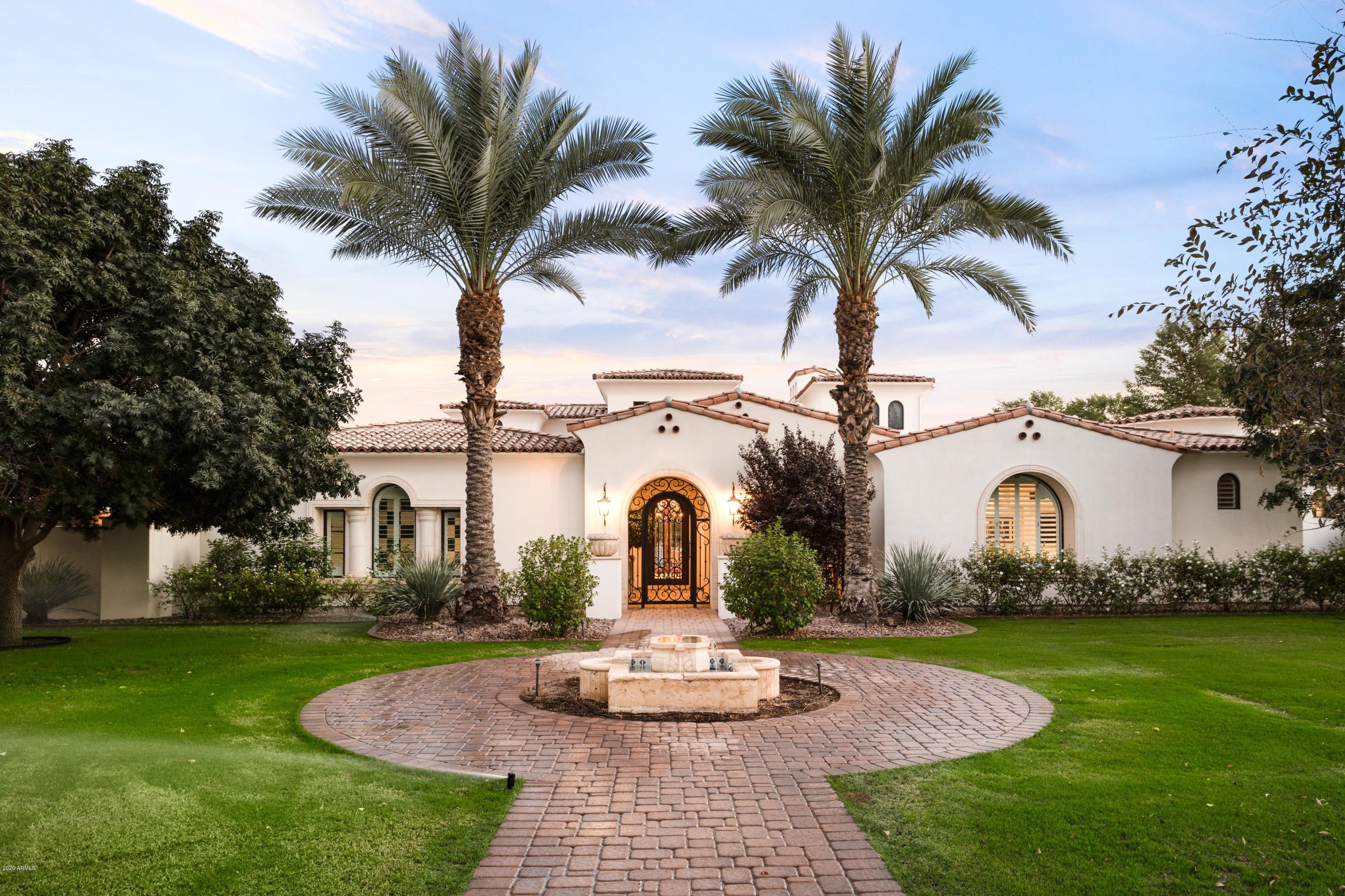 Ideally located behind the privately guard gated community of Judson, sits a slice of Santa Barbara. Built by reputable builder Jon Wall with interior design by 21 interiors, this home was built to both impress and enjoy. Focused toward a well curated life, features of note include, stunning marble and limestone surfaces throughout, charming court yards, artfully designed light fixtures, stunning Arch lined hallways and designer wall coverings.  The outdoors are unparalleled with a large pool with fire features, mature landscape, multiple grilling stations, expansive patios and cozy ramadas, an outdoor shower, basketball sport pad and a gated motor court. The home wouldn't be complete without a large state of the art gym and showroom style garage. Ideally located near the new epicenter of Paradise Valley this home provides the perfect environment to relax at home or entertain a crowd.