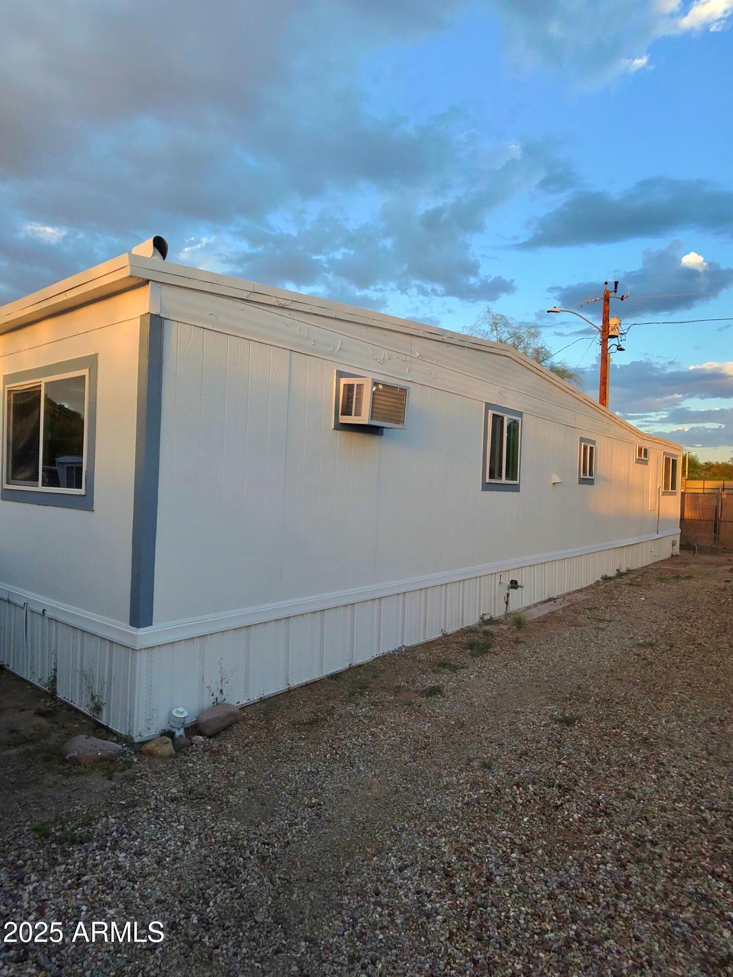 Well-located lot in a desirable North Phoenix area near Cave Creek Rd and Loop 101. Perfect opportunity to own in a quiet community with mountain views and easy access to nearby schools, parks, and shopping. Utilities available and ready for your new manufactured home or custom build. Buyer to verify all facts, figures, and utilities.