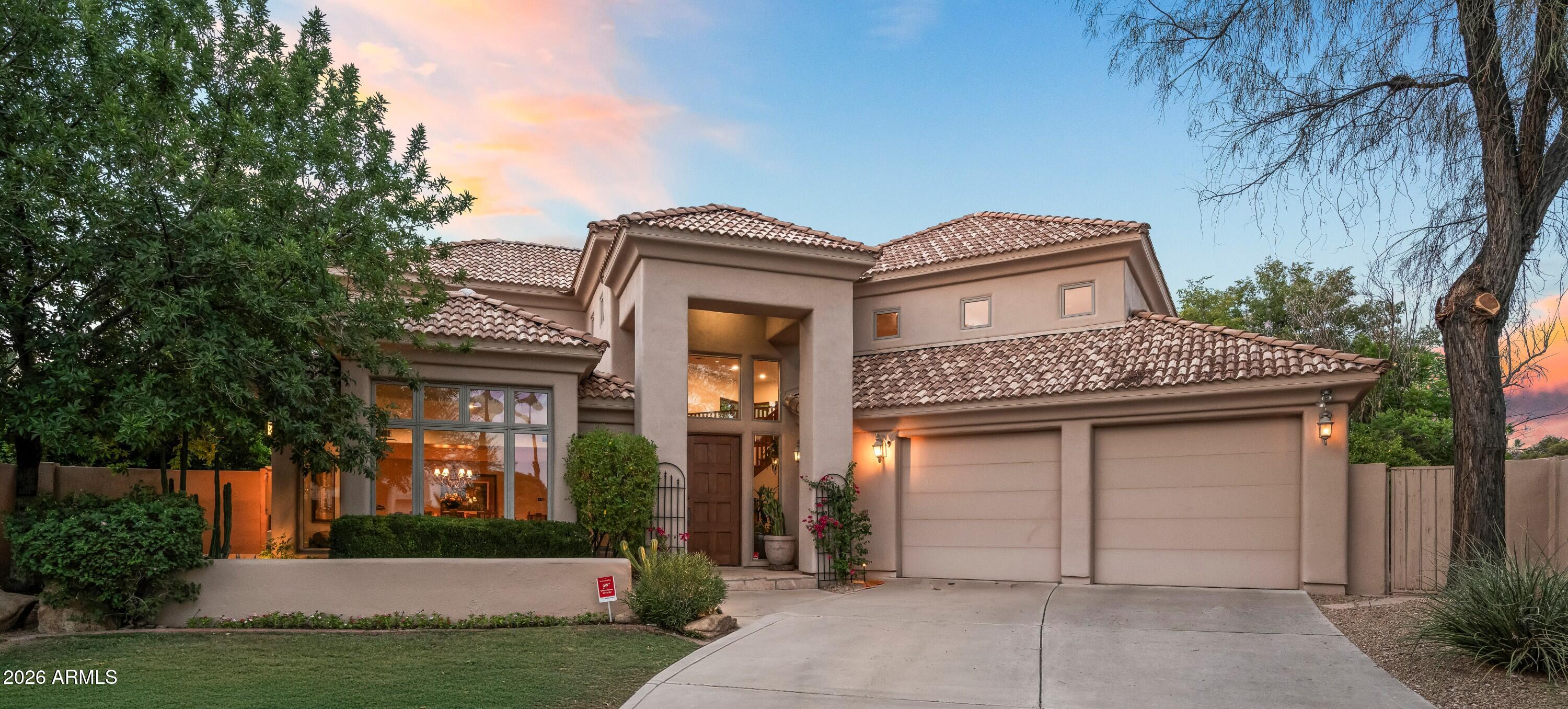 Ideally situated within the exclusive gated community of Singletree Ranch adjacent Camelback Golf Club, this spectacular custom-built home offers privacy and security along with breathtaking golf course and mountain views.
A dramatic entrance welcomes you with 20-foot soaring ceilings, a grand staircase, formal living room and stately dining room, all framed by picture perfect views, creating a perfect space for entertaining.
The spacious chef's kitchen features a center island, Sub-Zero side-by-side refrigerator-freezer, double-wall oven and a warming drawer. The kitchen flows seamlessly to the inviting family room with high ceilings, custom-built-in entertainment center and a majestic fireplace.
The private backyard features a resort-style pool, ramada with built-in-barbecue, lush landscaping, mature citrus, Ficus trees, a huge grass play area and multiple covered patio area, designed for year-round outdoor living and entertaining.
The light-filled floorplan features a luxurious main-level primary suite with hardwood flooring, a spa-like bathroom and closet with built-in cabinetry. A second room on the main floor is ideal for guests or a home office.
Upstairs are three additional bedrooms, three bathrooms and a loft. The third bedroom, nicely tucked away for privacy with its own full bath, includes an outdoor sitting area.
The location, in the heart of Paradise Valley, is convenient to upscale shopping, dining, and area airports.