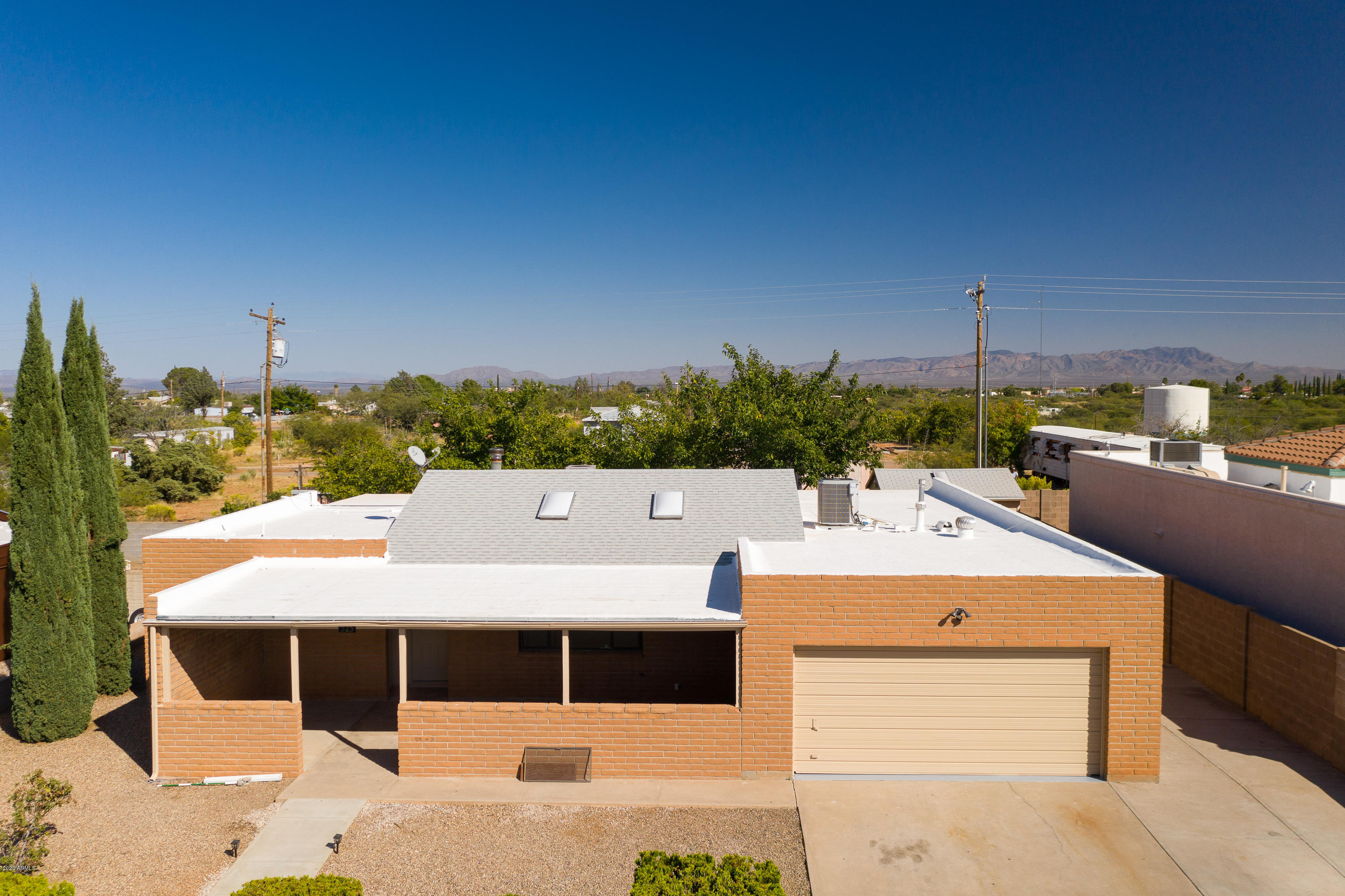Almost 2300 SqFt of living! New kitchen with Granite Counters and all stainless steel appliances. Granite in bathrooms. Huge master suite with walk in closet. Split bedroom floor plan. Workshop in back with A/C. Mature trees, lovely front patio for cool mornings. Wood stove in family room. Huge heated and cooled Arizona room.