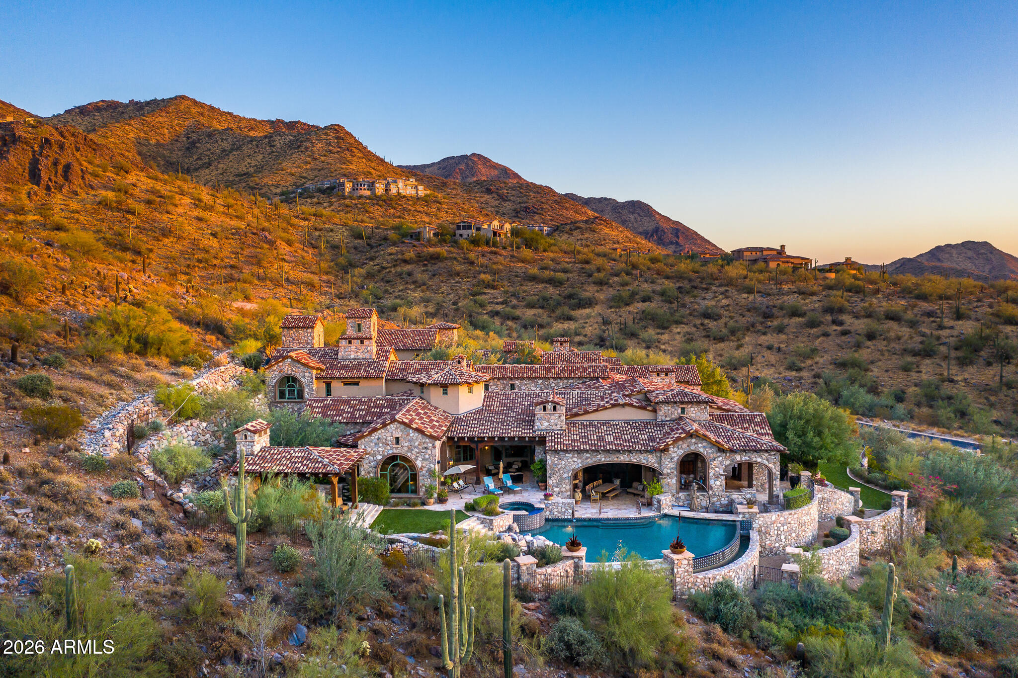 Privately Situated within the prestigious Upper Canyon of Silverleaf, this Ranch Hacienda estate offers an unparalleled combination of privacy, craftsmanship, and breathtaking natural beauty. Framed by the dramatic McDowell Mountains and showcasing sweeping panoramic views in every direction, this exceptional 11,491 square foot residence is situated on nearly 3 acres.  Priced to sell, well below recent neighborhood comps -  a very rare opportunity in this highly coveted community!

Designed with both grand entertaining and comfortable family living in mind, the home showcases remarkable attention to detail throughout. Rich architectural elements include extensive natural stonework, hand crafted millwork, trestle beam ceilings, a distinctive brick barrel ceiling in the kitchen, custom tile installations, expansive retractable glass doors, and a striking great room feature wall. Other amenities include a separate prep kitchen, dedicated wine room, dog bath opening to fully enclosed dog run, professionally designed media room, fireproof safe room, and bonus room above the garage, perfect for private office or grandchildren retreat.

 

The estate's enduring architecture, construction quality, and spectacular setting create a foundation that is increasingly difficult to duplicate.  Property is  priced well below replacement cost offering incredible value to a buyer with opportunity to enhance and personalize a residence whose scale, craftsmanship, and coveted Upper Canyon location would be extraordinarily costly to recreate today.

 

The floor plan features five spacious bedrooms, including four private suite-style retreats, in addition to a centrally located home theater and an inviting great room that seamlessly connects indoor and outdoor living spaces. Multiple covered patios lead to an impressive resort inspired yard complete with an outdoor kitchen, putting green,  pool ramada, negative edge pool, rockslide, and swim up bar. A private gated entry opens to a magnificent motor court accented by balconies and a welcoming fireplace, setting the tone for the grandeur that awaits inside.

 

Located in Silverleaf, a private, guard gated community located minutes away from top area shopping, dining, hiking and resorts, featuring a private Tom Weiskopf-designed golf course and award winning club and spa.  Immediate Clubhouse (social) memberships are available to a Buyer. From the moment you arrive, you'll appreciate the exceptional quality, stunning vistas, tranquility, and sense of exclusivity that define this remarkable Silverleaf estate.
