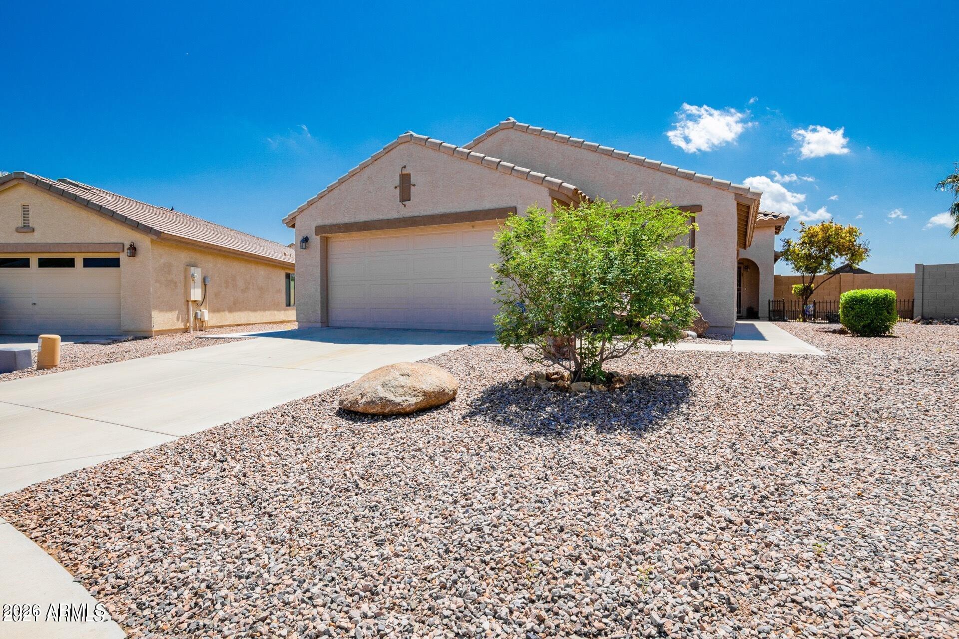 Gorgeous 3-bedroom home with a den/office that could easily be converted into a 4th bedroom. Sitting on an oversized 11,000+ sq ft lot w/RV gate, there's plenty of space for a pool and more, features a spacious family room open to the kitchen with granite countertops and a large island. Stainless steel appliances and the refrigerator stays. Tile and wood laminate flooring run throughout. Includes R/O system, water softener, washer/dryer, and a newer water heater. New window, A/C replaced in summer of 2023, added garage and attic insulation, garage racks stay, shed stays. Enjoy mountain views with no neighbors behind you!