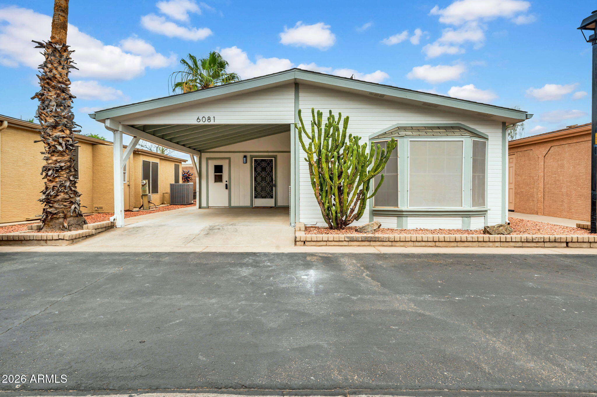 OWNED LAND! NO LOT FEE! Sunbird Gem! Enjoy peaceful, low maintenance living in your completely remodeled home! All new cabinets, counters, appliances, washer/dryer, paint, flooring and more! This is really a ''see if to believe it''. Quiet community with no landscaping! Come see this today!