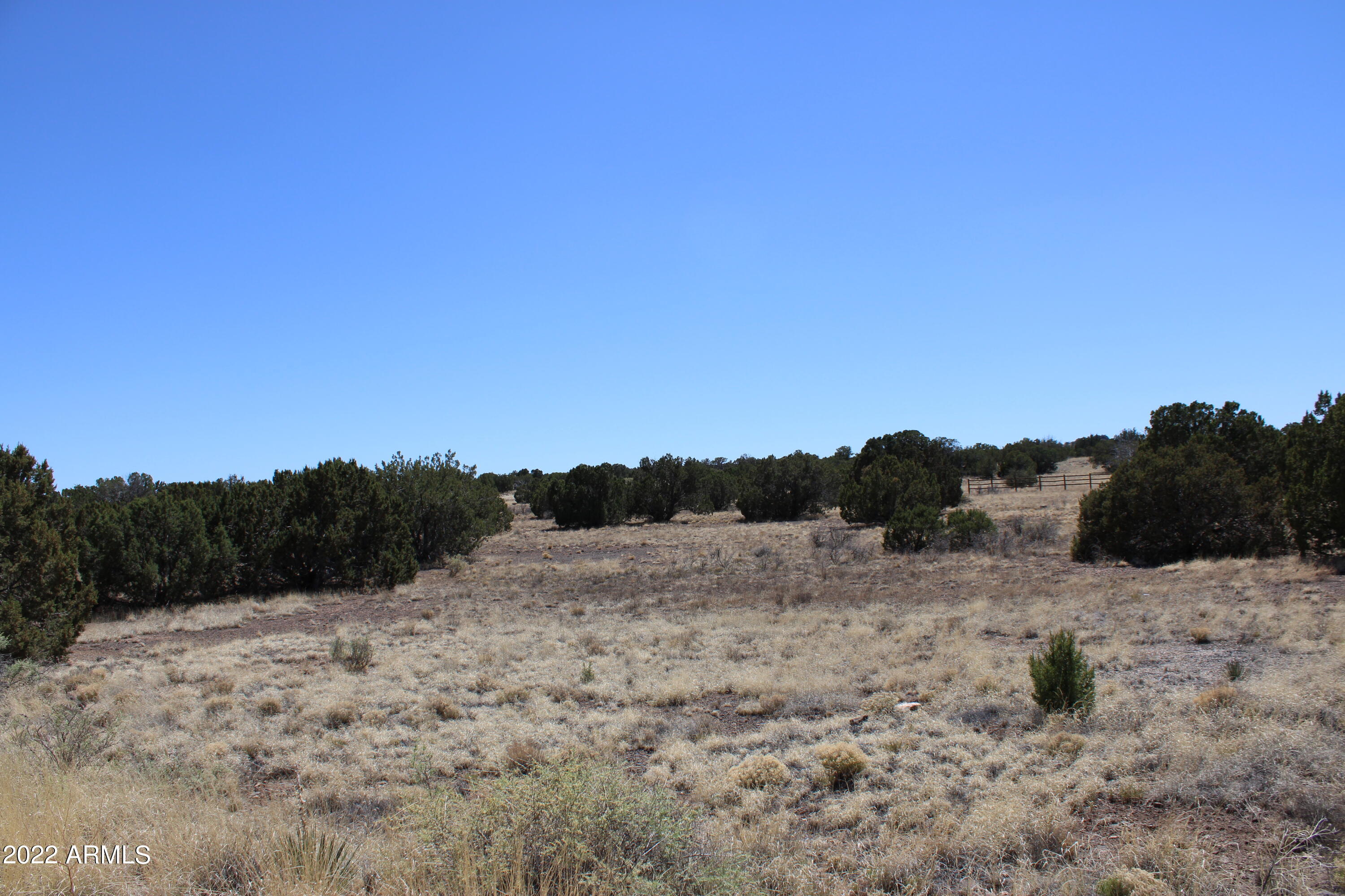 Over 1 acre to build your custom home. Improvements include landscaped entry, paved streets, water and underground power and phone throughout the subdivision. The community has vista views of Silver Creek and the lush valley below. Residents can privately hike and fish along Silver Creek. Come check it out today.
Seller is a licensed Real Estate Broker in the State of Arizona.