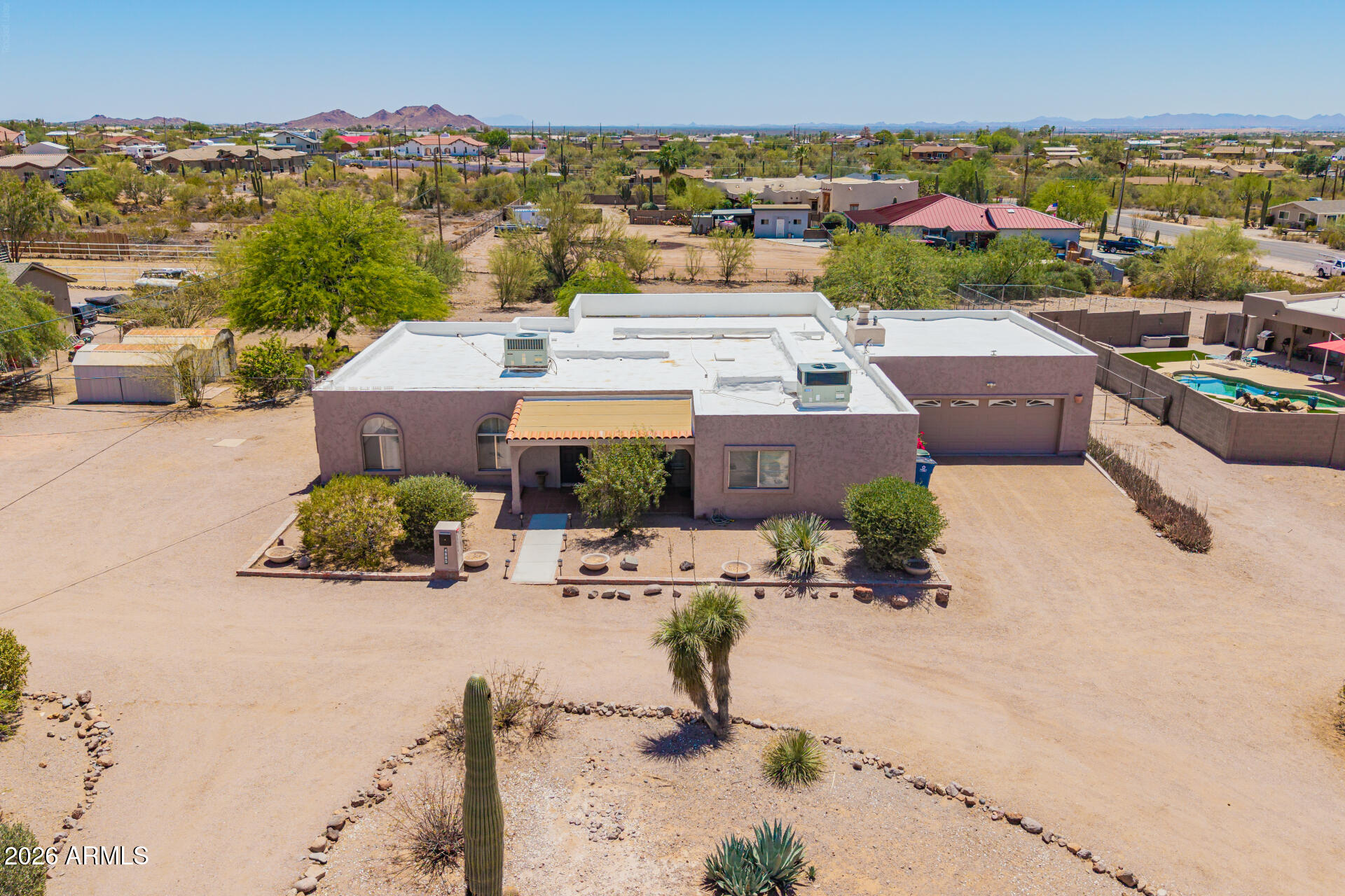 Welcome to an exceptional opportunity to own a slice of Arizona desert beauty on 1.26 acres with breathtaking views of the Superstition Mountains. This versatile property offers the perfect blend of space, functionality, and lifestyle in the rapidly growing Apache Junction community. The main home features 3 bedrooms and 2 bathrooms. A private 1-bedroom Next Gen apartment with its own entrance and full kitchen provides incredible flexibility ideal for multigenerational living, guests, or an office. The oversized two car garage provides plenty of extra space for tools and toys. A spacious Arizona room adds flexibility for additional living, dining or entertaining. Enjoy the freedom of rural-style living with room for animals. Whether you're looking to create your own mini homestead or simply enjoy wide-open space and stunning desert sunsets, this property delivers. Take advantage of a rare opportunity to invest in both lifestyle and location.