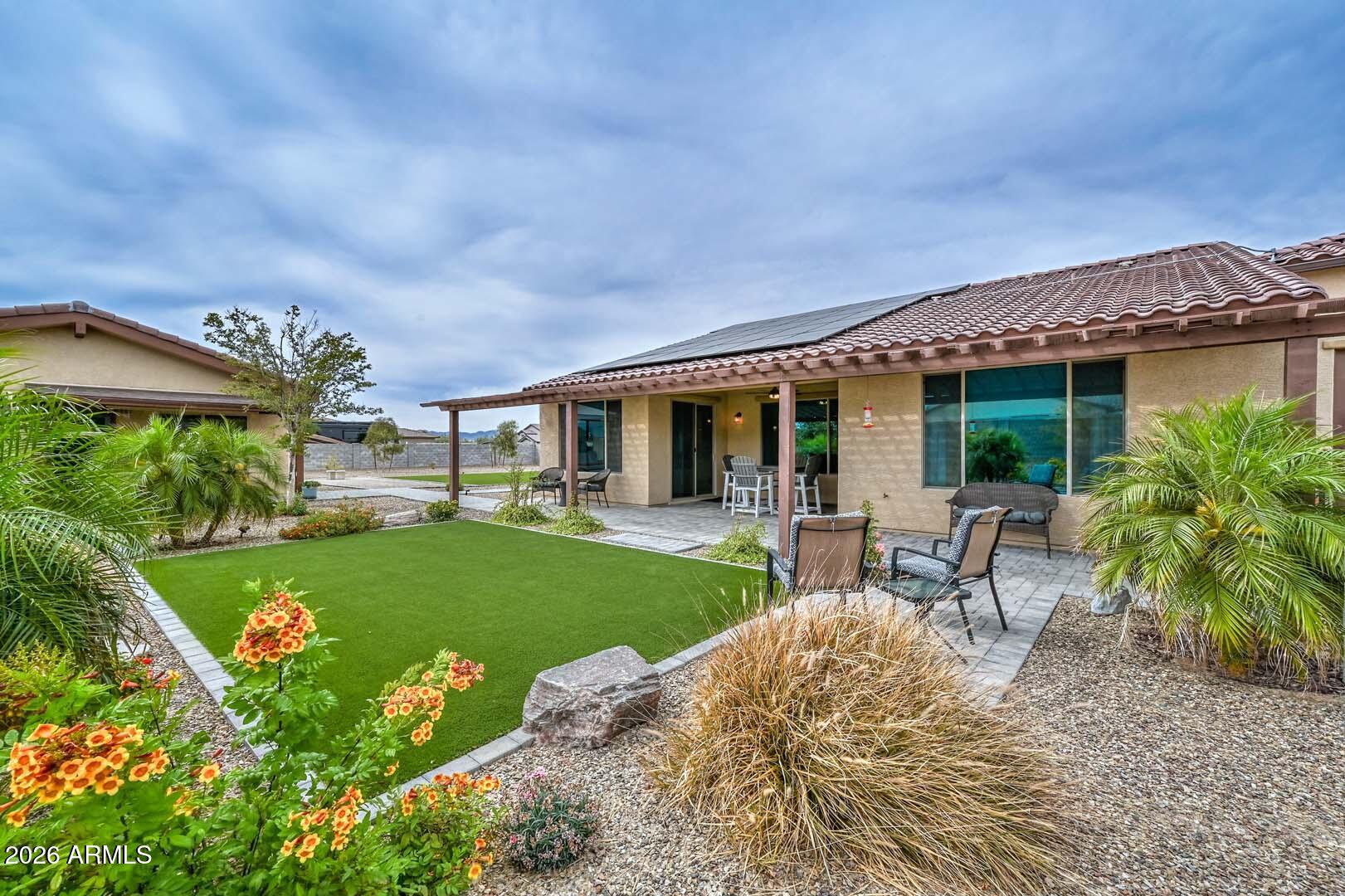 Seller Offering a 2-1 Interest Rate Buydown! * On nearly an Acre of lush, manicured grounds in Luke Ranch Estates, this exceptional residence blends refined style & everyday comfort enhanced by a Fully Owned solar system for Energy Efficiency. The impressive curb appeal & expanded cobblestone driveway hint at the thoughtful upgrades found throughout. Inside, a warm, inviting interior showcases a neutral palette, elegant Union Stone tile flooring, upgraded carpet in the bedrooms, 5¼'' baseboards, & custom blinds & window treatments. The spacious Great Room & Casual Dining Area are perfectly positioned to capture serene views of the beautifully designed backyard. The chef-inspired Kitchen is both functional & stunning, featuring 42'' cabinetry w/ dovetail, soft-close construction, sleek quar countertops, an oversized island w/ bar seating & added storage, plus a premium Samsung stainless steel appliance package including a convection oven & upgraded induction cooktop. The Primary Suite offers a true retreat w/ a generous walk-in closet & a beautifully upgraded, enlarged shower w/ frameless 3/8" glass surround. Two additional bedrooms w/ walk-in closets, a versatile Office/Den (ideal as a formal dining space), & an expansive laundry room w/ abundant storage complete the main home. Step outside to enjoy seamless indoor-outdoor living. The extended covered patio, custom pergola, & paver walkways create multiple inviting spaces for relaxation & entertainment, all surrounded by low-maintenance landscaping w/ turf, trees, plants, & a full irrigation system. A Standout Feature of this property is the Stunning ~750 sq ft Guest House, offering a private retreat complete with its own Great Room, Bedroom, full Bath, and a fully upgraded Kitchen with quartz countertops and Café Appliances, including an Induction Cooktop. A spacious front porch with sunshades enhances comfort & privacy. Additional highlights include a 3-car tandem garage, an Extended, Fully Insulated and Temperature-Controlled 52-foot RV Garage, RV Parking, plus expanded parking. This one-of-a-kind property offers space, versatility, & upscale living, an exceptional opportunity not to be missed.
