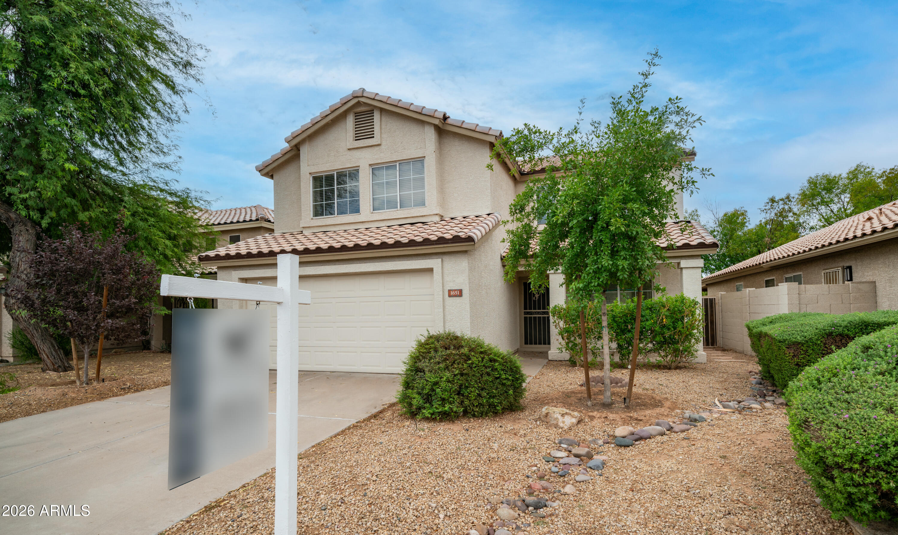 Set within the lush, tree-lined community of Andersen Springs, this well-maintained West Chandler home enjoys a premium N/S lot backing a greenbelt framed by mature shade trees. Light, bright & open front porch entry welcomes you into the 3 bedroom, 2.5 bath floor plan featuring a spacious loft with closet. The central kitchen with newer stainless appliances & large single-bay sink overlooks the family room with wood-burning fireplace. Generous primary suite with walk-in closet, extended dual-sink vanity, separate tub & shower. Abundant storage throughout! 2024 Bosch high-efficiency 20 SEER heat pump with Ecobee smart thermostat, newer roof & exterior paint. Quick Loop 101 access near Chandler Fashion Center, dining & entertainment!