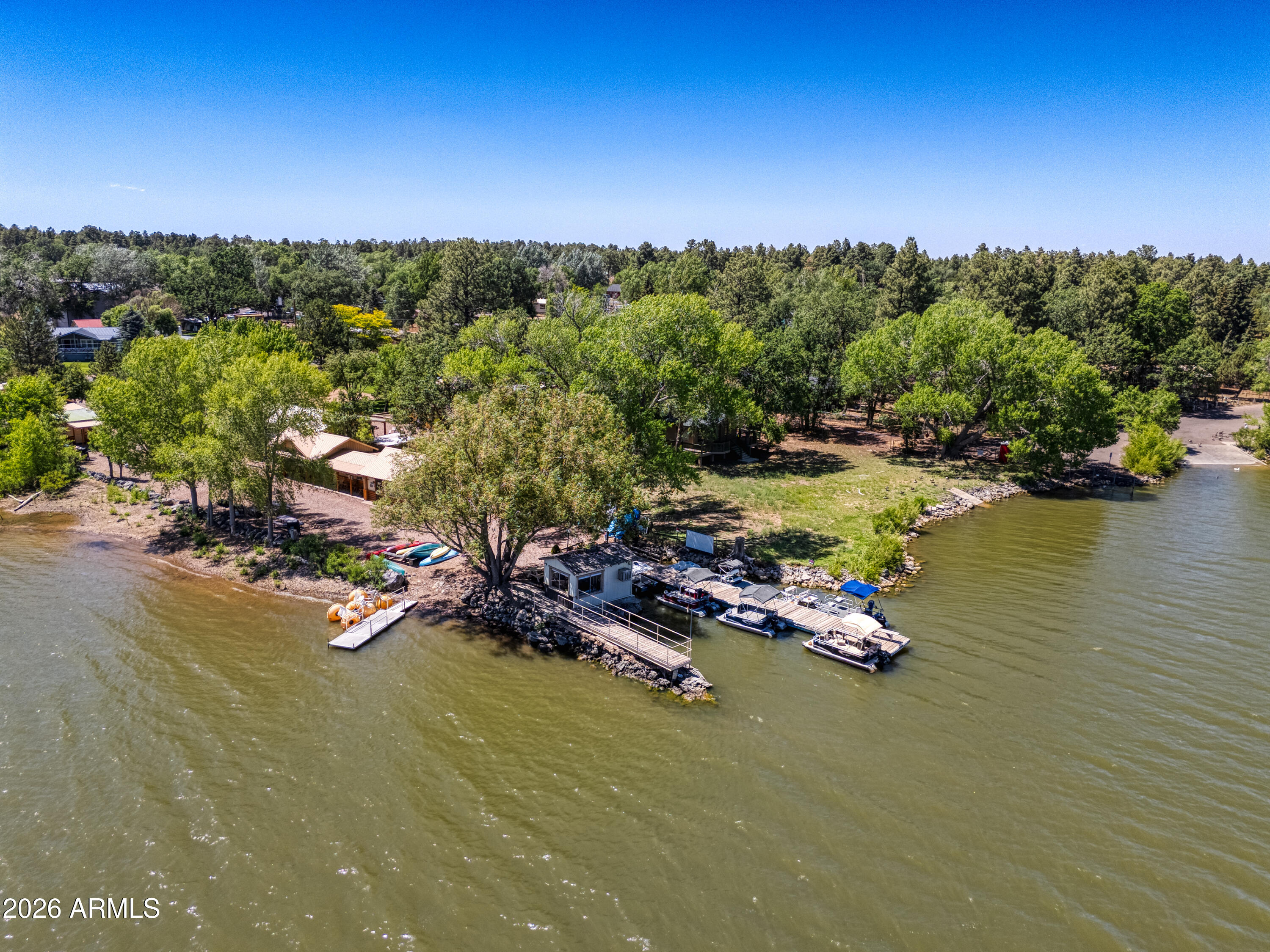 Rare Lakefront Resort Investment Opportunity on Rainbow Lake(APNs212-25-017A & 019A)!Own one of Arizona's most sought-after waterfront lodging properties in the heart of the White Mountains.Rainbow's End Fishing Resort offers a unique combination of lakefront accommodations,established rental income, and an unbeatable recreational setting that keeps guests returning year after year.Ideally situated directly on Rainbow Lake, the resort is the only on-lake boat rental operation, featuring a fleet of pontoon boats,canoes,paddle boats,and kayaks that convey with the sale,providing an additional revenue stream.Guests enjoy fishing from the property, breathtaking sunsets, abundant wildlife,and a true mountain-lake experience.The resort is thoughtfully designed for families,outdoor enthusiasts,SE and vacationers seeking relaxation and adventure. Amenities include beautifully maintained grounds, lakeside fire pits, outdoor BBQ areas, a volleyball court, horseshoe pits, cornhole, frisbee golf, and expansive green spaces for recreation and gatherings.
Located in the highly desirable Pinetop-Lakeside area, the property provides easy access to year-round attractions including golf, fishing, hiking, boating, hunting, off-road adventures, skiing, snowboarding, seasonal festivals, live entertainment, dining, and more. The White Mountains are renowned for their pristine lakes, cool mountain climate, breathtaking scenery, and abundant wildlife, including elk, deer, bald eagles, osprey, cranes, geese, ducks, and other native species.
This resort, first established in 1959, with buildings ranging from 1959 thru 1986 presents a rare opportunity to acquire premium lakefront lodging with multiple income sources in one of Arizona's most popular mountain destinations. A truly exceptional investment offering both lifestyle appeal and long-term growth potential.
One of the owners is a licensed Real Estate agent in the State of Arizona.