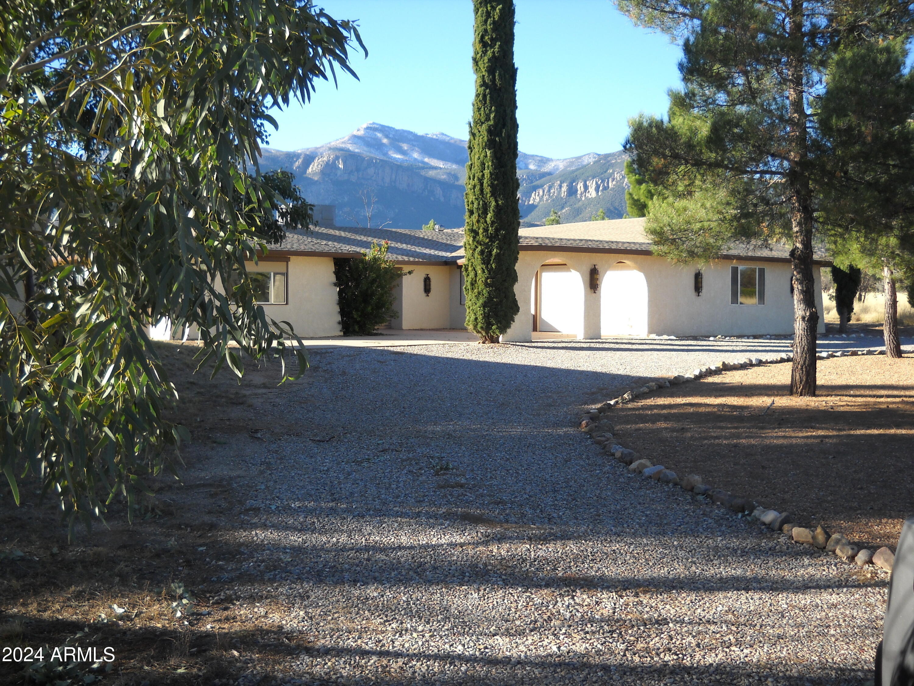 Nice mature neighborhood with nice vegitation going toward the mountains.  Three bedroom two bath with two car garage attached.  Kitchen granite counter tops with stainless steel appliances.  Lots of cupboards. Large laundry room inside off the kitchen.  Tile through out wood burning fireplace, formal dinning area.  Lots of window with gorgeous views.   Move in ready pets OK.