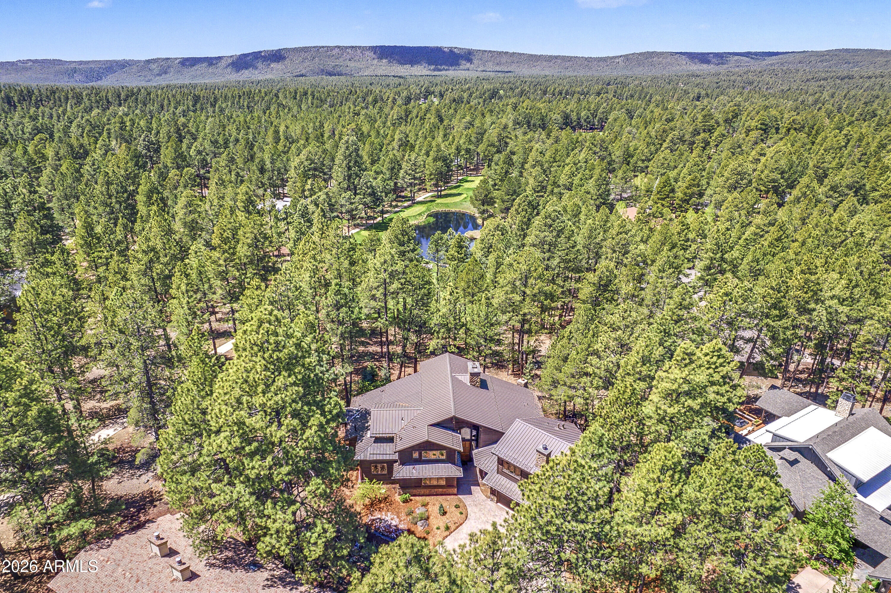 Golf Course and Lake views!! Situated in a private cul de sac and perched above the 4th green of the Canyon course.  This home has all the spaces you need and outdoor living that takes in all the amazing views. The great room boasts a massive stone fireplace, wall of windows that frames the golf course and lake.  5 total bedroom suites with ensuite baths.  The Master suite, an additional guest suite and large office is on the main level and 2 additional guest suites upstairs.  The secret room is a large suite complete with wet bar, bedroom, bathroom and full family room.  Fully equipped open chef's kitchen with multiple islands. Top it off with beautiful landscaping, central A/C and a 3 car garage!
