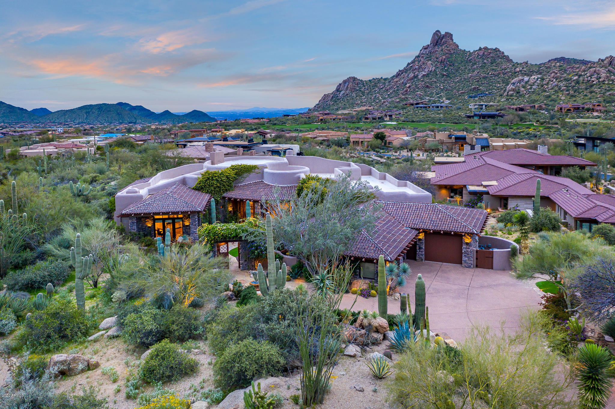 A regionally relevant architectural statement designed by Lee Hutchison on an elevated lot with unobstructed views of Pinnacle Peak * Southwest contemporary design that has been meticulously remodeled to open up the floor plan and provide a fresh take on a timeless design * True indoor/outdoor living, highlight by pocketing doors leading to an outdoor living room for year-round enjoyment * 
Unparalleled quality with stone & hardwood flooring, furniture-grade cabinetry, hand-plastered wall finishes, butted-glass windows to views & multiple gas fireplaces * Floor plan includes kitchen opening to living & dining spaces, Master Suite, two guest suites, plus an office with full bath (or 4th bedroom suite) * Exceptional outdoor living area with multiple covered patios, gas fireplace & fire pits outdoor kitchen, heated pool/spa, water features & custom landscape design *