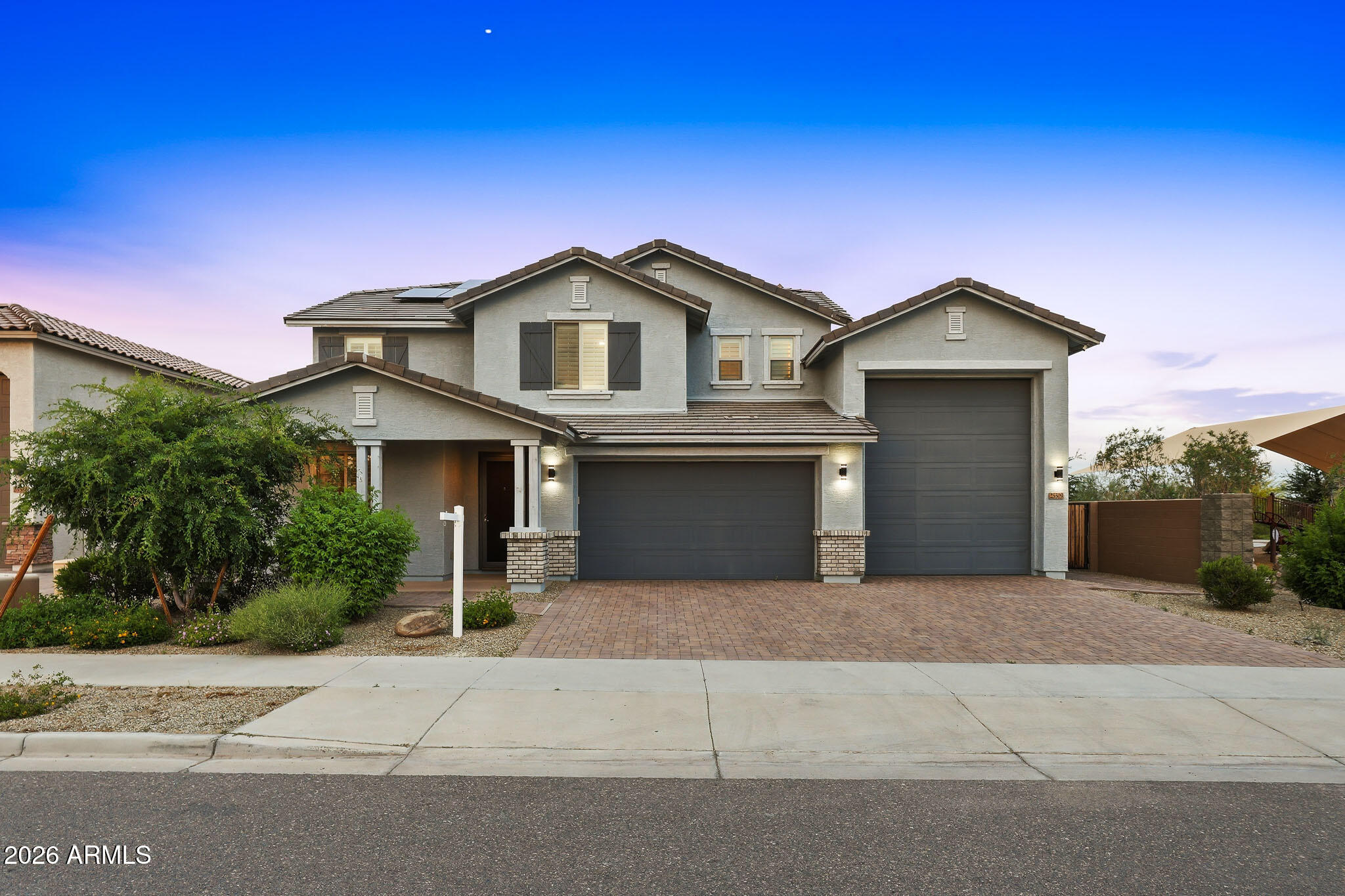 Luxury, views, and room for everything you love await in this stunning 4-bedroom + loft, 3-bath home offering 2,818 sq ft on a premium corner lot with no neighbors behind or to the side and unobstructed mountain views. Designed for both everyday comfort and elevated living, this property features a 5-car garage including a dedicated RV bay, and the owner spared no expense with over $182,000 in upgrades throughout.

Inside, you'll find gorgeous plank flooring, plantation shutters, and high-end finishes in every room. The open-concept layout seamlessly connects the kitchen, family room, and dining area, making it ideal for entertaining and daily.. living. The chef's kitchen is a true centerpiece with quartz countertops, subway tile backsplash, staggered soft-close cabinetry, a huge walk-in pantry, butler's area, and a large eat-in island with pendant lighting. The premium GE Café stainless steel appliance package -- including a 6-burner gas range and French door refrigerator -- completes the space beautifully.

The downstairs bedroom and full bath are perfect for guests, a home office, or multigenerational living. Upstairs, the split primary suite feels like a private retreat, featuring a spa-inspired bath with a soaking tub, custom tile surround, dual quartz-topped vanities with Kohler sinks, and an oversized shower with rain and handheld heads, bench seating, and tile to the ceiling. The walk-in closet is equally impressive. Two additional spacious bedrooms, an upgraded full bath, an oversized laundry area, and a versatile loft provide flexibility for a playroom, media room, office, or lounge space.

The low-maintenance backyard was built for entertaining and relaxing, with paver patios, artificial turf, solar lighting, and view fencing that perfectly frames the mountains. Enjoy unforgettable evenings around the sunken fire pit lounge, or host with ease from the raised outdoor kitchen featuring a Turbo 4-burner stainless steel grill, refrigerator, sink, and custom backsplash. The covered patio with ceiling fan and TV mount completes the outdoor living space.

Bring all your toys -- this neighborhood was built with RV living in mind, and each home in the immediate area includes a dedicated RV garage. The epoxy-coated 3-car tandem garage plus the massive RV bay with cleanout and 60-amp service gives you space for up to 5 vehicles, an RV, boat, UTVs, side-by-sides, storage, and more. Additional functional upgrades include an RV dump/cleanout, overhead storage, a cleanup sink, and a soft water system.

The 14kW solar system is fully paid off and will convey to the buyer at closing, delivering major energy savings and dramatically offsetting APS bills. The seller is happy to provide the last 12 months of electric bills -- they are impressively low. This is a rare opportunity to own a home that blends luxury, function, efficiency, and lifestyle in one exceptional package.