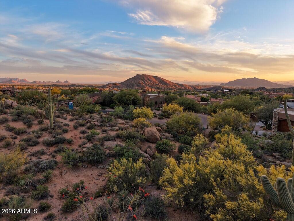 Phenomenal Golf homesite in Desert Mountain's premier Village of Saguaro Forest. Situated on the 17th hole of Chiricahua course, this site is .8 acres with a building envelope of 18,922 SF.  This lot may be combined with adjacent lot, 154 also for sale for rare combo lot along golf course. This lot has unique boulder outcroppings, city lights, sunsets, surrounding mountain views, and golf course views! The views during the day are spectacular, but the drama unfolds as the sun goes down with sunset colors in all directions, shadows casted on saguaro studded hills, and mountain silhouettes come alive! Bike or hike from your home to the nearby Desert Mountain Trails with over 20 miles of multi-use trails. Chiricahua and Cochise Geronimo Clubhouses are nearby for quick access to dining and golf. The Sonoran Fitness Center's state-of-the-art fitness facility is a short drive away. Inquire for building envelope and to meet onsite.