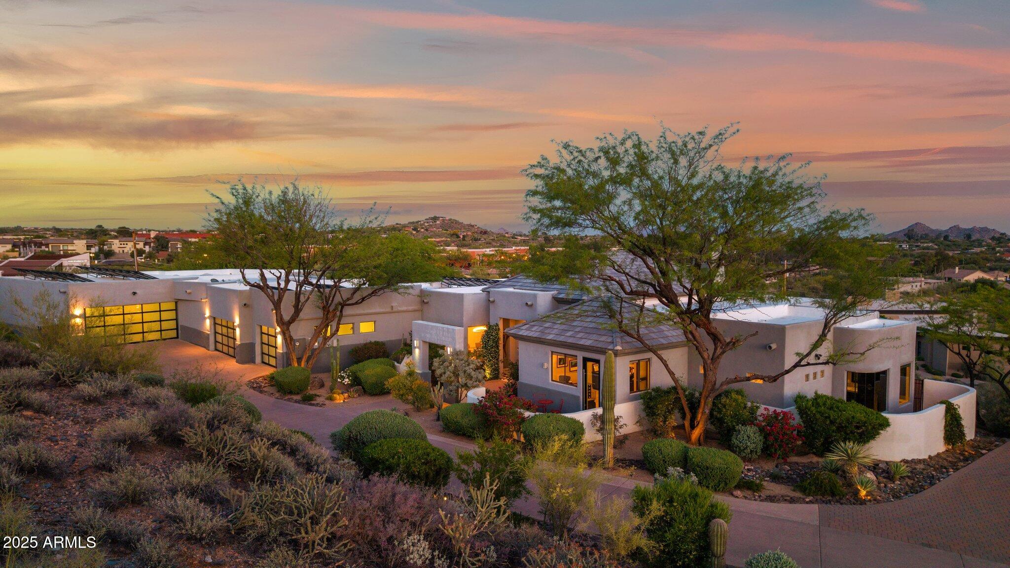 Move in and start living. This fully furnished, modern luxury home in Carefree combines panoramic Sonoran Desert, up close mountain views, refined contemporary design, and proximity to Arizona's premier golf destinations.
Nearby golf is exceptional, with Whisper Rock, Estancia, Desert Forest, Desert Mountain, and Troon all nearby, along with convenient proximity to the WM Phoenix Open at TPC Scottsdale, placing world-class courses and tournament energy within easy reach.
Designed and updated as a true turnkey residence, the home offers a light-filled open floor plan with clean architectural lines and intentional finishes throughout. Four spacious en-suite bedrooms function as private retreats, each offering comfort, quiet, and flexibility for guests or extended stays. The chef-level kitchen features Sub-Zero and Wolf appliances and flows effortlessly into the main living spaces, making it ideal for both casual mornings and entertaining after a day on the course. 

A state-of-the-art home theater delivers a cinematic experience for watching major tournaments, hosting game nights, or enjoying late-night movies.

Outdoor living is resort-inspired, anchored by a sleek pool, generous patio areas, and expansive desert vistas that capture Carefree's natural beauty, impressive Sunsets and City Lights.

The property is within walking distance of the Town of Carefree, offering rare pedestrian access to dining, coffee, boutique shopping, and local events while maintaining privacy and serenity.

A notable highlight is the dual oversized garage configuration with parking for up to seven vehicles, including one fully climate-controlled garage, ideal for car collectors, golf equipment, storage, or a personal workshop.

This is a rare opportunity to own a modern luxury home in Carefree that delivers turnkey convenience, elite golf proximity, thoughtful design, and an easy, elevated Arizona lifestyle.