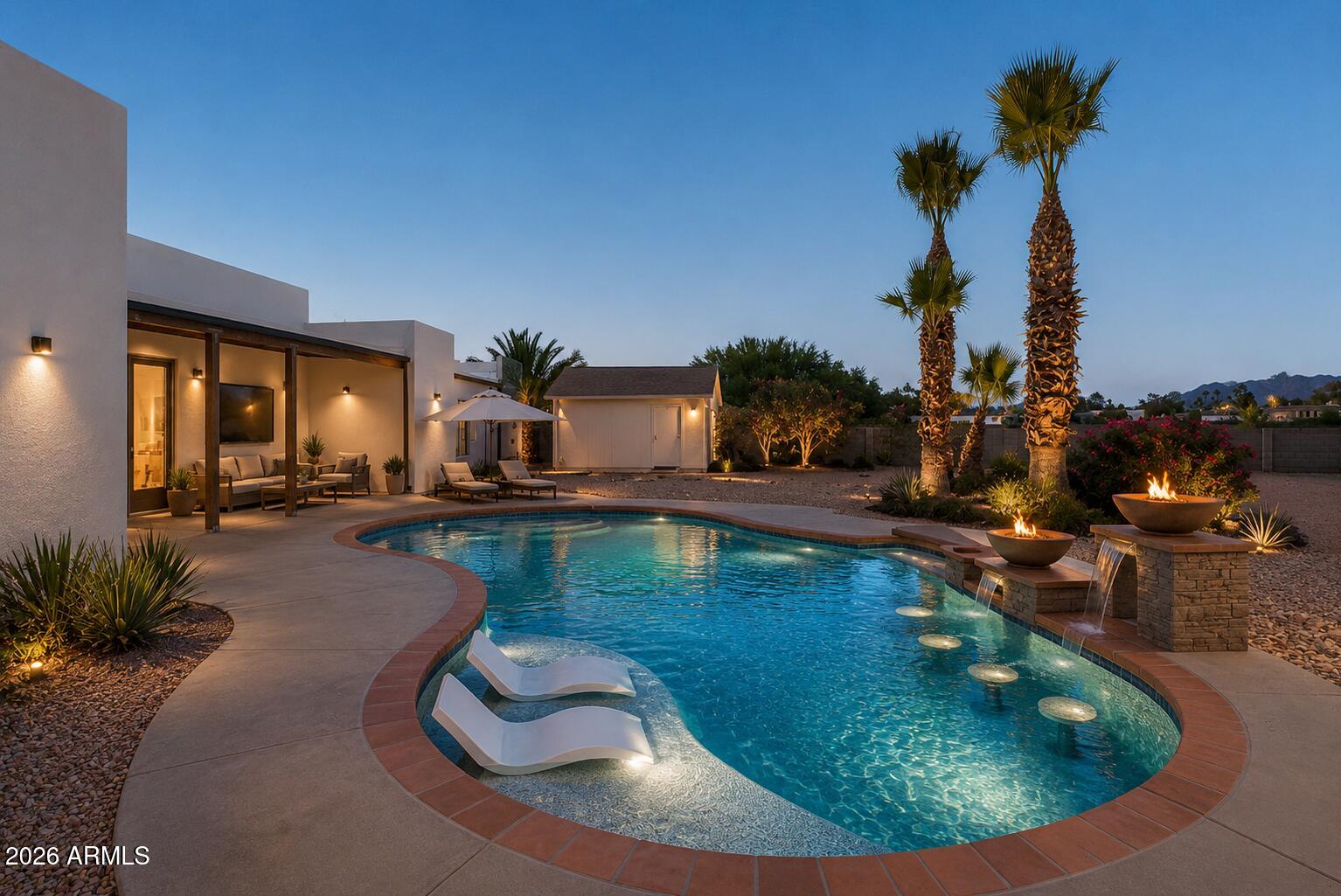 Experience elevated desert living in this exceptional Scottsdale estate, perfectly positioned on an expansive private lot with a circular driveway and impeccable curb appeal. Designed with luxury in mind, this stunning residence showcases high-end finishes throughout, ceilings accented with gorgeous rich wood beams, an immense amount of natural lighting coming through the large front and back windows, and a thoughtfully designed split floorplan offering ultimate privacy. Retreat to the lavish primary suite with a spa-inspired bath designed for relaxation and sophistication. Large, tiled shower with separate soaking tub, his and her sinks, and a primary walk-in closet that would be the envy of anyone who sees it. Both the primary bedroom and closet offer separate entrances to your backyard, and laundry is conveniently located both by the primary and secondary bedrooms. Two secondary bedrooms include their own en-suite bathroom with glass enclosed showers, providing comfort and convenience for family and guests alike, and all bedrooms have walk-in closets. The chef's kitchen features stunning custom white cabinetry and granite counters accented by a large island with black granite counter and cabinets, and stainless-steel appliances with built-in ovens. Your pantry is a room of its own with numerous shelves and separate sink for convenience. Added cabinetry with beverage cooler in your dinette area allows for a coffee bar, liquor display cabinet, and more. This seamlessly opens to your elegant living and entertaining spaces with fireplace. Enjoy movie nights in the theatre room, which also can be used as a dedicated home gym or office. Attached to the main home is an oversized four-car garage with epoxy flooring and in the backyard is a separate two-car garage accessible through the RV gate, which also leads to the expansive RV parking area. Enjoy breathtaking sunsets and views from your backyard complete with a sparkling private pool and ample space to entertain, relax, and take in the Arizona lifestyle.