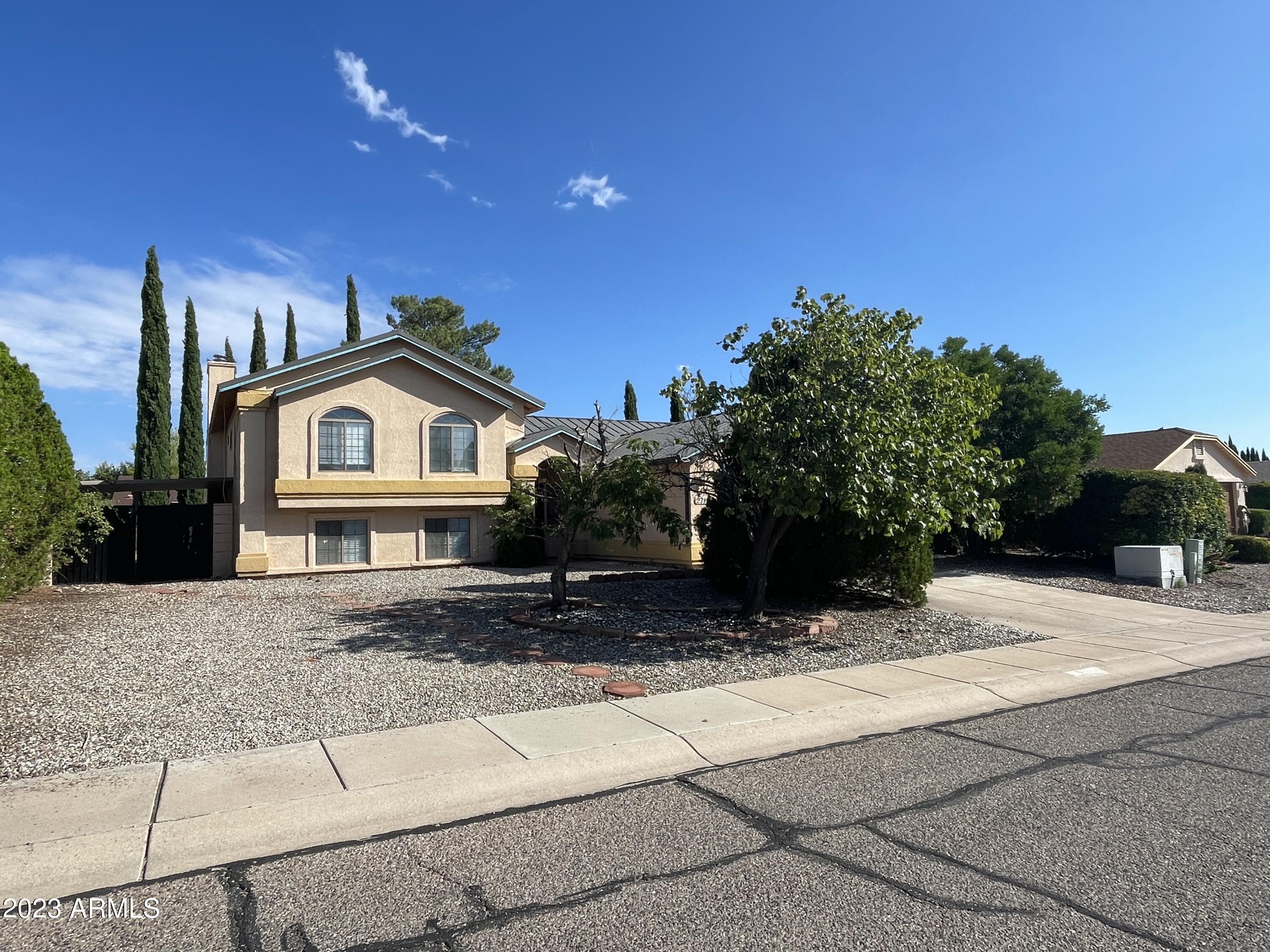 This large home with over 2400 sq feet. Split-Level design with 5 bedrooms is located only minutes away from Ft. Huachuca. The 2 bedrooms on the bottom level and a private family room is ideal for family members wanting their own space. The freshly painted interior adds to the charm of this home. The kitchen with its modern appliances and ample work space are any cooks delight. Included are a gas range, two ovens, and built in air fryers. The brand new AC unit will have you relaxing in comfort. The backyard has an enclosed pool area for safety, and an RV gate for additional parking. The 5 bedrooms are spacious, with a balcony off the Master bedroom. You will not be disappointed.