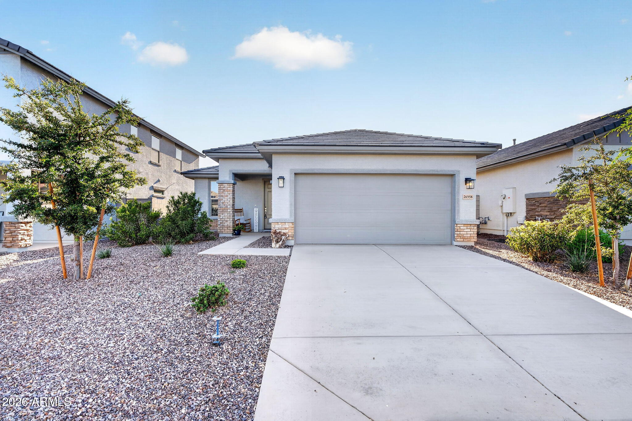 No design center appointments. No waiting 9 months hoping your home gets finished on time. This nearly-new Landsea Madera floor plan in the sought-after Sunrise community is ready right now & the current owner has already done everything you'd wish the builder had included. The open-concept layout immediately makes sense. A dedicated study that works as a home office or flex space & a flow that just feels right from the moment you walk in. But what separates this home from every other new build on the market is the technology baked into every corner. Apple HomeKit smart home integration, whole-house automation, geofencing, & a whole-house air purification system. You're not just buying a home. You're buying a healthier, smarter way to live. This backyard is where this home really wins. The owners envisioned something special and delivered it: a private hot tub for unwinding under the Arizona stars, a cozy fire pit for those perfect desert evenings, pet-friendly synthetic turf that stays lush and green year-round without lifting a finger, and raised garden beds already producing fresh tomatoes and jalapeños. It's like having a salsa maker that conveys with the home! This is the backyard you've been pinning on Pinterest, and it's already built. And the location? Surprise is one of the fastest growing and most desirable cities in the entire Phoenix metro. Close to the Loop 303, White Tank Mountain trails, Lake Pleasant, Surprise Stadium, top-rated schools, and the booming employment hubs of the West Valley. The Sunrise community itself offers parks, walking and biking trails, and a genuine sense of neighborhood. The new construction down the street doesn't have this backyard. It doesn't have these upgrades. And it's not available today. This one is. Don't let someone else get it first.