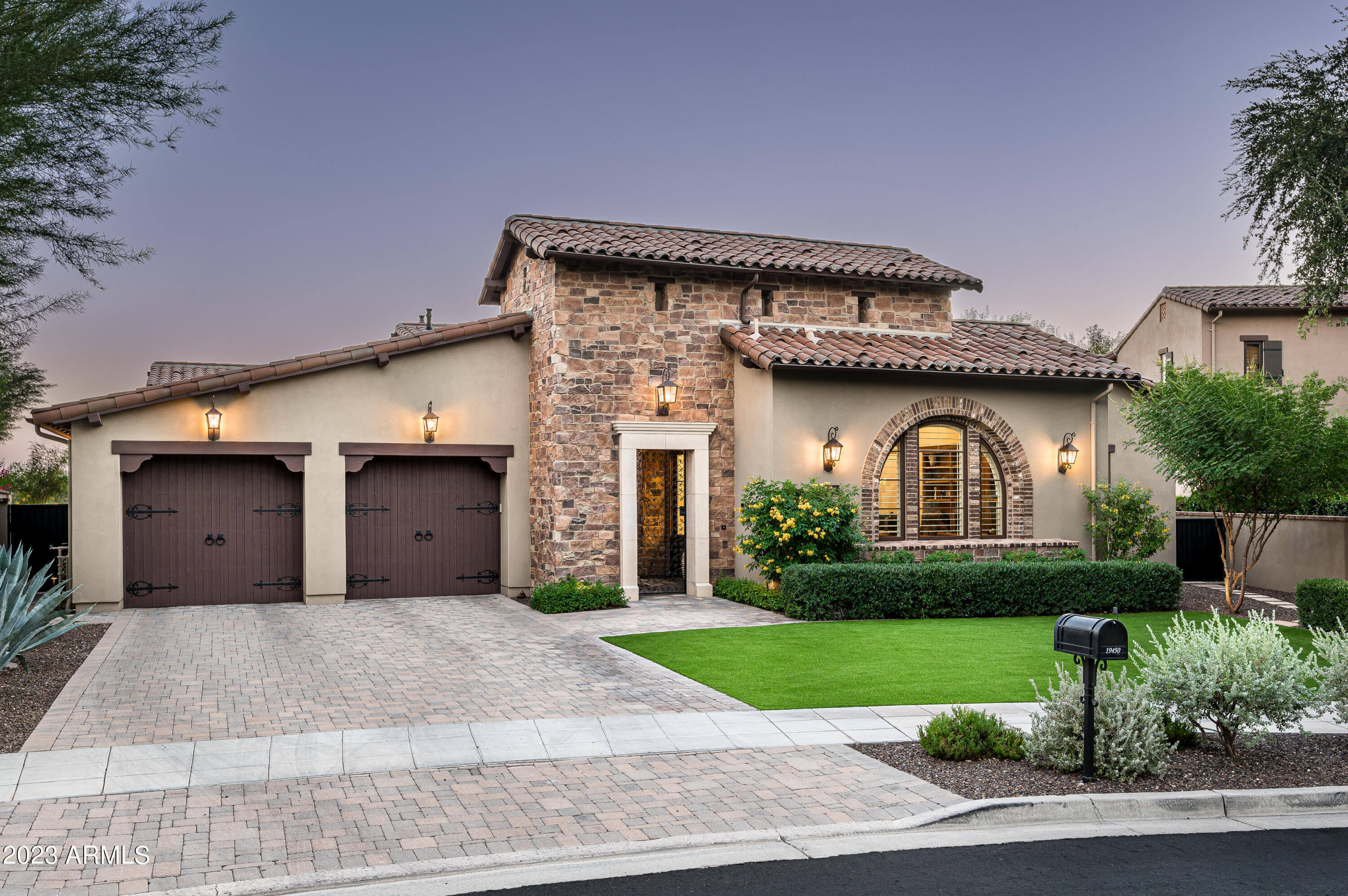 Experience stunning mountain and city light views from this thoughtfully updated single-level home located in the Horseshoe Canyon neighborhood of Silverleaf. Comprising four bedrooms, including a separate guest casita, this 4,228-square-foot residence boasts refined finishes throughout including wood flooring and Taj Mahal quartzite countertops in the kitchen. Electronic pocket doors create seamless outdoor living where you will discover a new pool, barbecue island, putting green, and tasteful travertine pavers. The homeowners have diligently updated various features of the property to complement the interior.