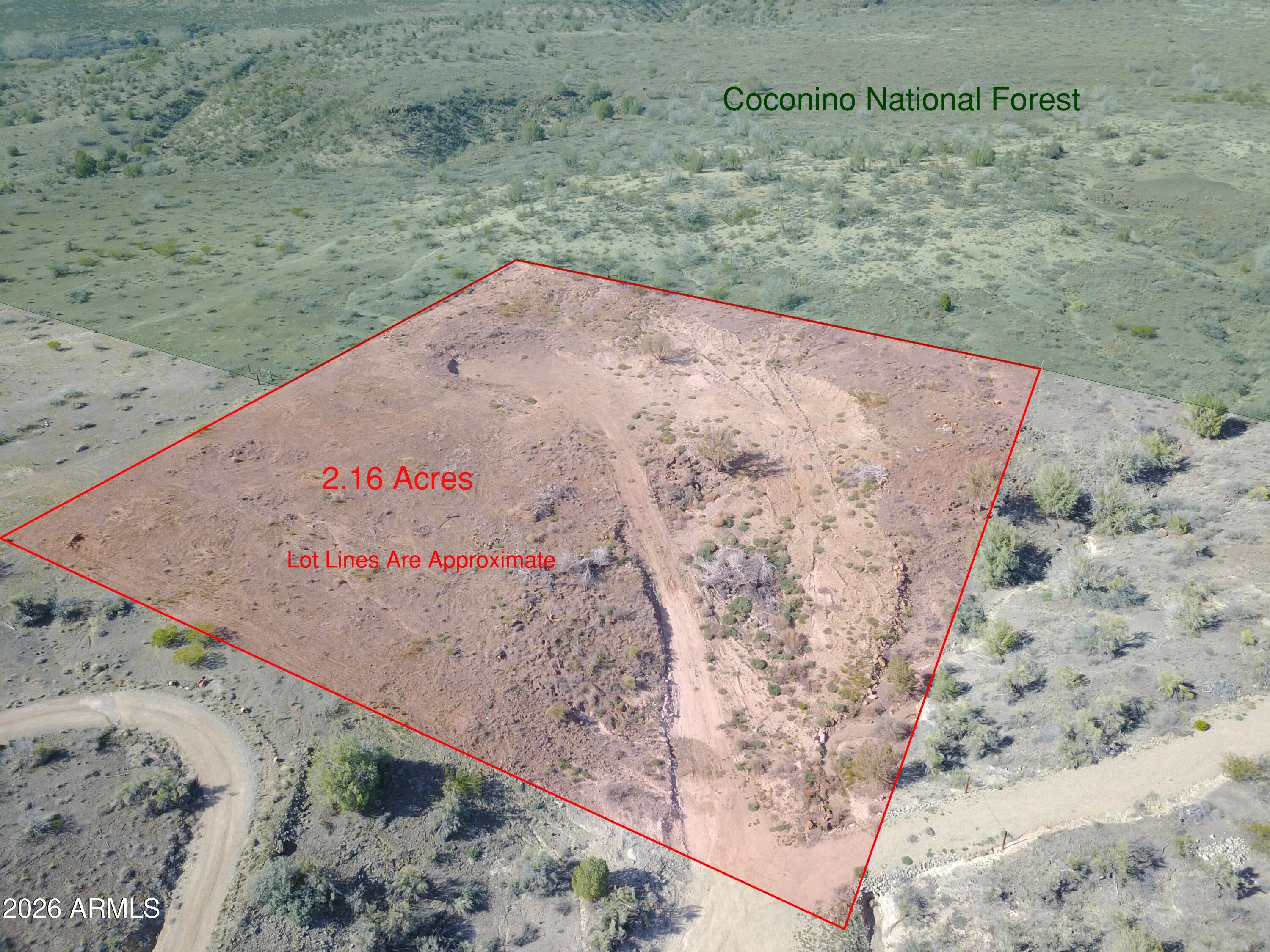 Premium 2+ acre cul-de-sac parcel backing Coconino National Forest. This property offers exceptional privacy with no rear neighbors and direct access to thousands of acres of protected land stretching toward the Village of Oak Creek and Flagstaff.

The previous owner began site improvements including a building pad and partial fencing, providing a head start for a custom home, barndominium, or manufactured residence (buyer to verify utilities and improvements).

Zoned for site-built or manufactured homes with horses and farm animals permitted. Ideal for a private estate, horse property, hobby farm, or recreational retreat.

Opportunities to own land bordering National Forest are limited. Secure a unique piece of Rimrock with long-term potential.
