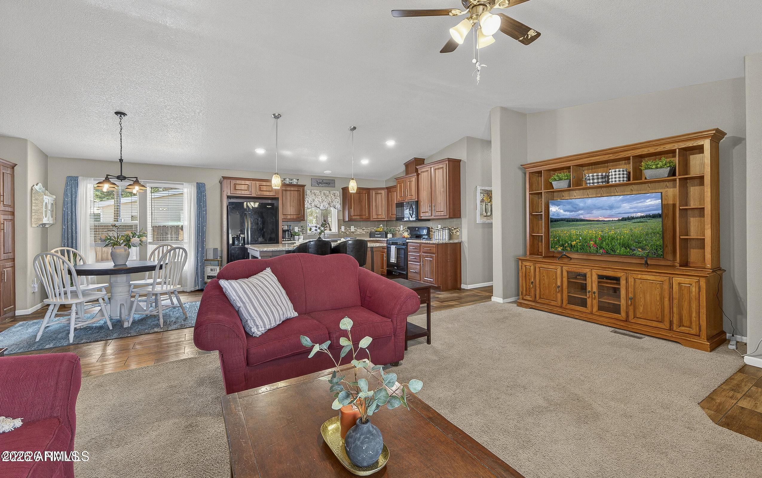 Welcome to this charming home in the desirable Kachina Village neighborhood, surrounded by mature ponderosa pines for a peaceful, private setting. Inside, you'll find an inviting layout filled with natural light, offering comfortable living and entertaining spaces. The well-designed kitchen features ample storage and an eat-in dining area, making it functional for a variety of lifestyles. Step outside to a spacious backyard with a wooden pergola perfect for covered seating, flagstone pathways that add character, and a storage shed for additional space. Enjoy easy access to nearby trails, forest service land, and outdoor recreation A great blend of comfort, charm, and appreciation for the beauty and tranquility of Northern Arizona living just minutes from Flagstaff. No HOA!