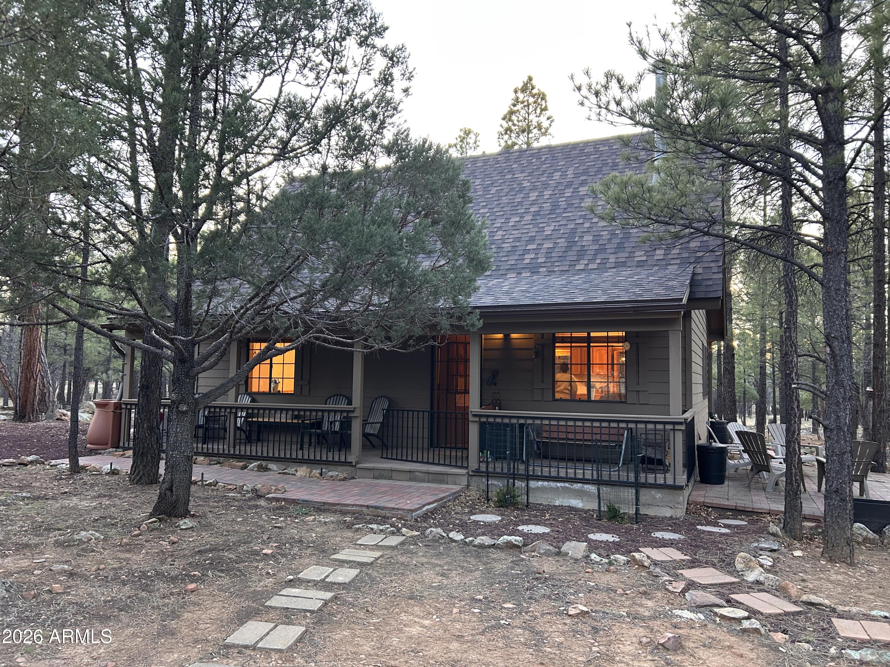 Charming Forest Cabin Retreat
2 bed, 1.5 bath, 1,136 sq ft cabin on nearly an acre of heavily forested land-perfect for escaping the Phoenix heat. Tastefully updated in 2026 with 20ft soaring ceilings, a cozy wood-burning stove, and a kitchen featuring mahogany countertops plus new range and dishwasher. New carpet and recently replaced roof offer worry-free living. Main level includes bedroom, full bath, living, dining, kitchen, mud room, and laundry. Upstairs loft offers half bath, storage, and flexible space for guests or office. Powered shed ideal for a home office & an on-site greenhouse for year-round gardening. Quiet, cool high-country living. The lowest-priced home in the area--homes like this are rare in the pines. come experience it in person this weekend!