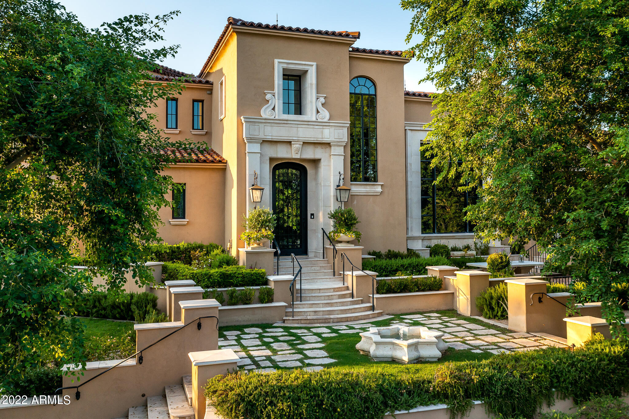 Arcadia at Silverleaf.  Authentic and charming, this modern Spanish Colonial custom estate is located on a premium corner lot overlooking one of Arcadia's signature parks and is the result of the craftsmanship of builder LaBlonde Custom Homes, superb architecture and interiors by Mark and Isabel Candelaria of Candelaria Design.  Warm and welcoming, this 7,641 sq. ft. home features 5 bedrooms, 6 bathrooms and 2 powder rooms and a 4-car garage. Modern and elegant Spanish finishes throughout include custom tiles, stone and wood floors, beam ceilings, limestone fireplace surrounds and custom cabinetry. While also exuding pure elegance this home is an entertainer's dream; featuring a gourmet kitchen, custom bar, game room, theater room and separate guest quarters.  Enjoy Arizona at its best, alfresco amenities include numerous covered patio areas for outdoor entertaining, charming fountains, large grass area, built in barbecue and sparkling spa and lap pool. All behind the gates of one of North Scottsdale's most charming and desirable neighborhoods.