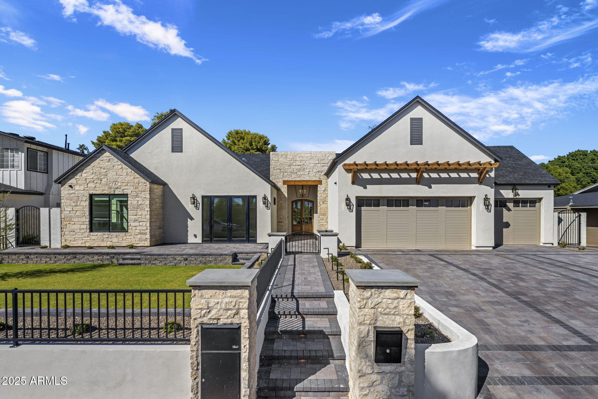 Brand new home in a highly sought-after neighborhood. This residence showcases high-end finishes, excellent landscaping, and a full smart-home system with speakers throughout the interior and exterior. The open layout highlights a custom bar complete with beverage drawers, a second dishwasher, and an ice maker. The mud room includes a built-in dog water faucet and drain, while every bathroom features power behind the mirrors for added convenience. Additional upgrades include air conditioning in the garage and a private outdoor shower. The covered patio and beautifully designed yard complete this thoughtfully crafted home, offering the perfect blend of modern luxury and everyday comfort.