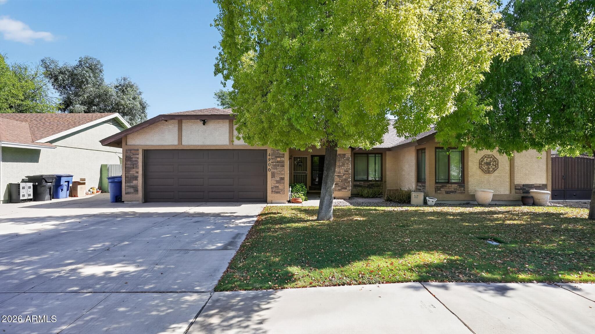 Welcome to this single-story Chandler residence featuring a private diving pool and NO HOA! Excellent curb appeal with a spacious 2-car garage greets you. Inside, vaulted ceilings create an open, airy ambiance across a light-filled floor plan. The kitchen showcases built-in appliances and a unique wood-accented breakfast bar perfect for entertaining. Relax in the expansive primary suite complete with a dual-sink vanity and a walk-in closet. The sprawling backyard is a true Arizona oasis, showcasing a deep covered patio, lush lawn, and a sparkling pool with a diving board. Ultimate peace of mind comes fully loaded with major mechanical updates: a brand new gas water heater (2024), a reliable 3.5-ton Trane
HVAC and a roof featuring 35-year shingles.
