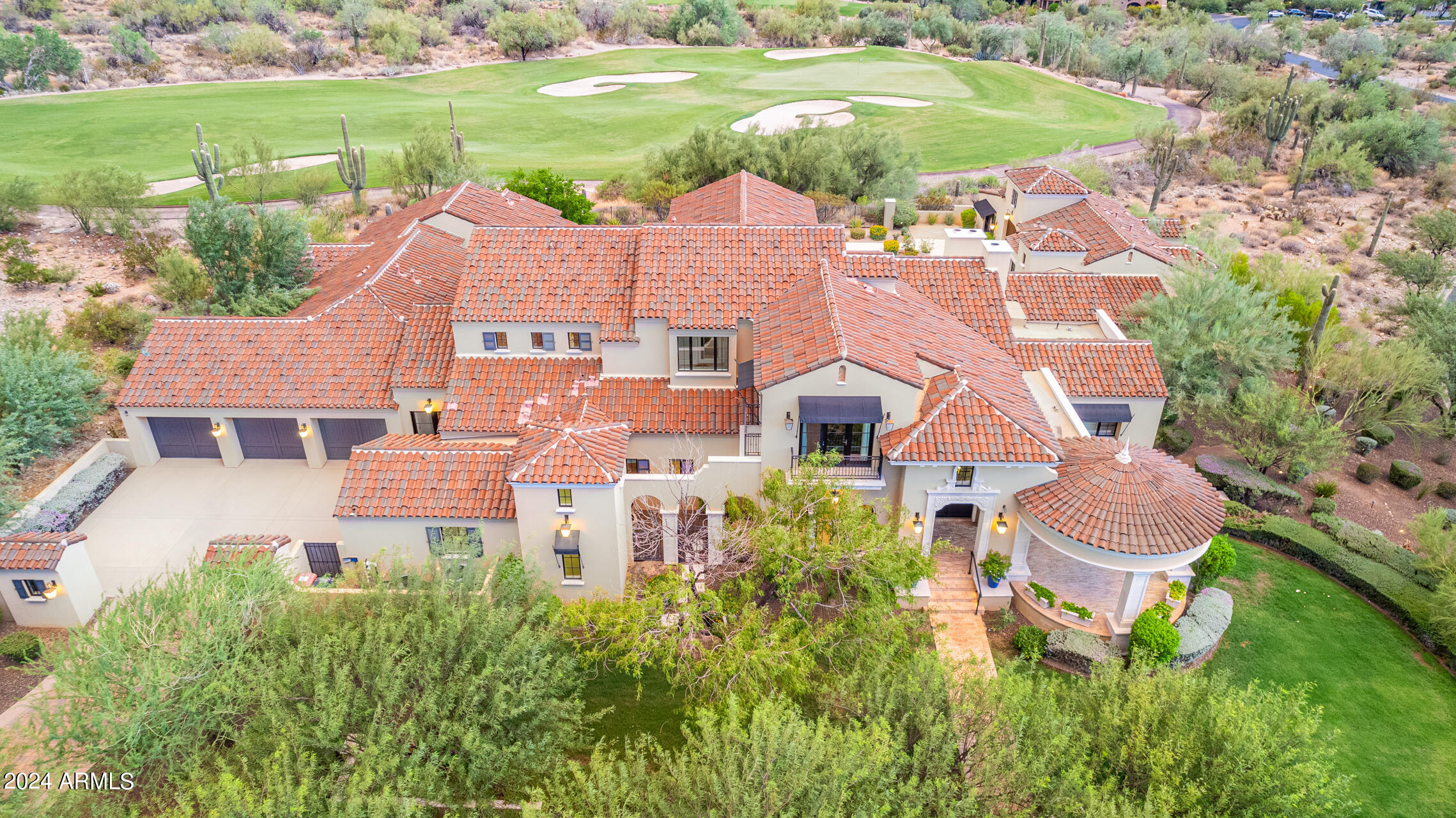 Beautiful Silverleaf corner lot on Weiskopf championship course with stunning mountain views. Immaculate custom build with no expense spared. Home lives on one level with bonus entertaining den and patio, gym /office or guest upstairs while three ensuite bedrooms off a kids living room on opposing wing from master, office and full casita all live ground floor. Private U shape around the pool, perfect hole location to capture soaring green course but not get hit by any balls. Close to the Upper Canyon manned entry guard gate and five minutes from prestigious Silverleaf and DC Ranch Country Clubs. Rich limestone floors, marble counters, his and her closets and vanities, rich oak floors and light bright high ceilings. Formal dining and living, numerous entertaining patios and bars.