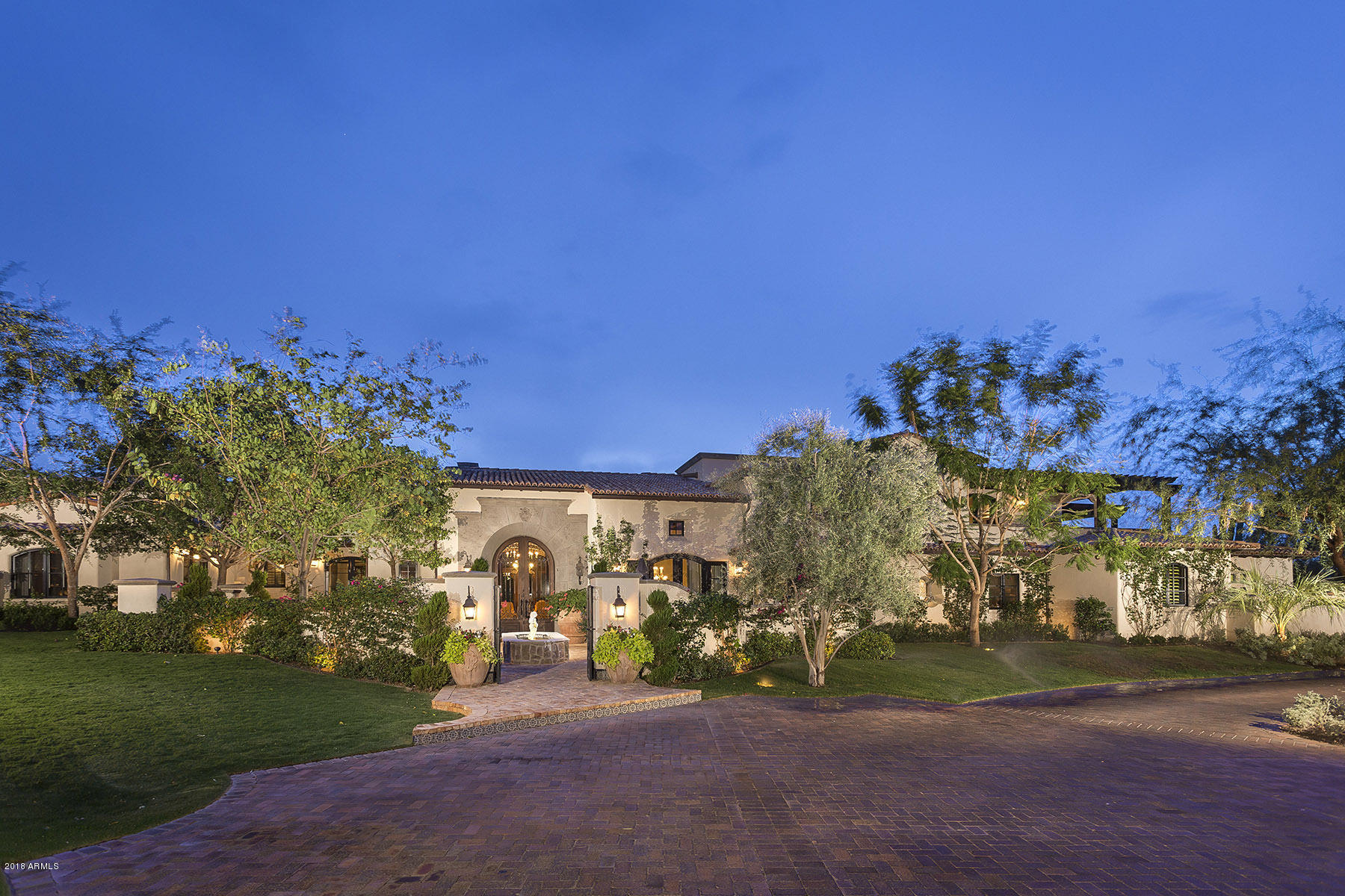Combining extreme privacy with beautiful mountain views this privately gated estate is a true oasis. Designed by Mark Candelaria and built by Nance Construction this exquisite Santa Barbara style 7,179 s/f home blends livability and sophistication creating the ultimate house for entertainment and relaxation. A gourmet kitchen with Viking, Subzero and Asko appliances opens to a large family room with casual dining and access to a central courtyard. The master suite is a perfect sanctuary with a cozy fireplace and his/hers closets and elegant bathrooms. The entertainer's dream back yard include a putting green, numerous citrus trees, dwarf olive hedges, pool/spa and mountain views. A four car garage completes this residence.