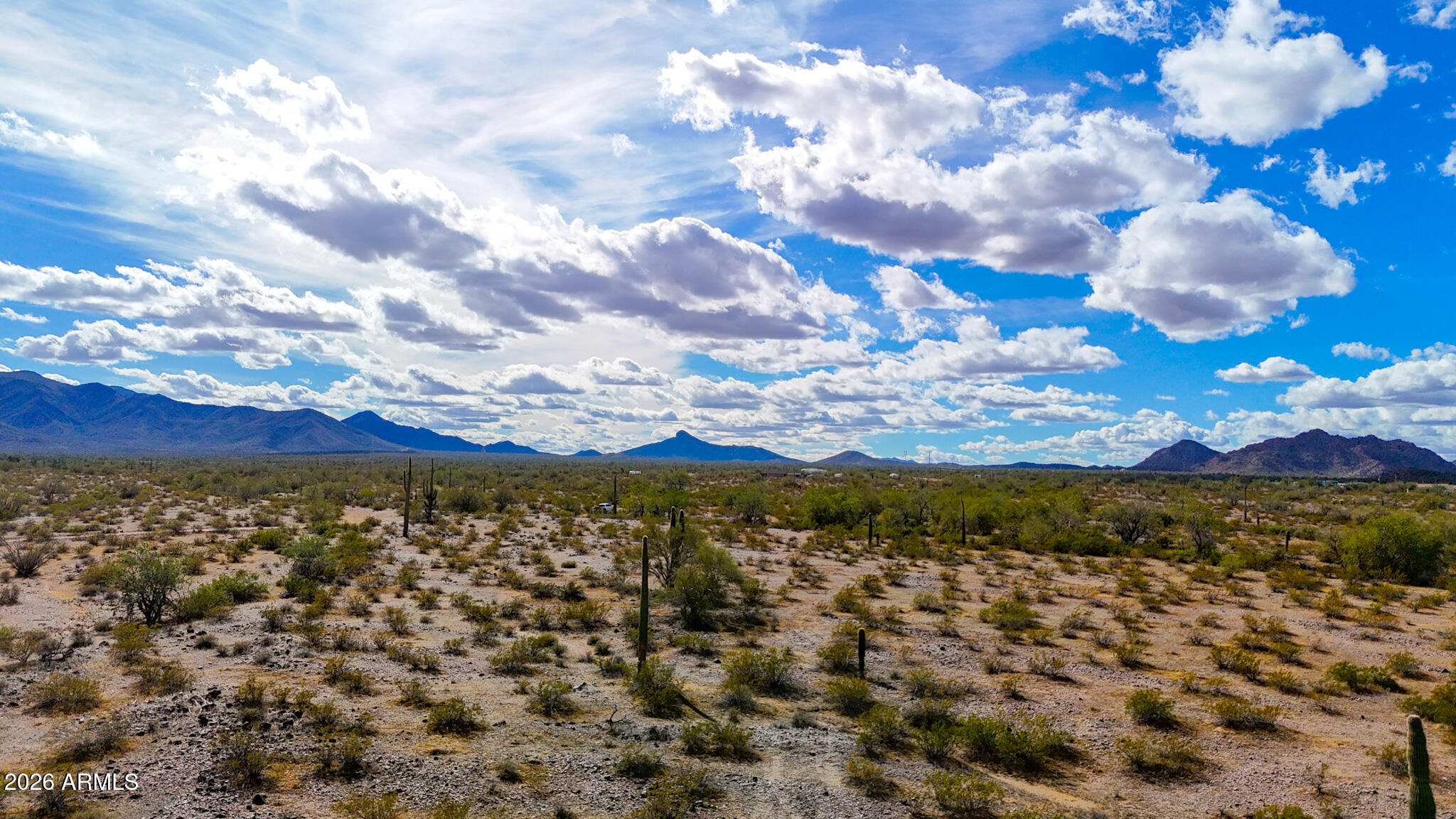 Very private, 1.67 Acres, surrounded by mountain views and with no HOA or CC&R's to limit you. Tons of solitude, starry night skies, tall saguaros and mesquite trees all come with this desert property. Amenities are just a short drive to town. Additional Acreage is available. SELLER FINANCING AVAILABLE. Survey split in process.