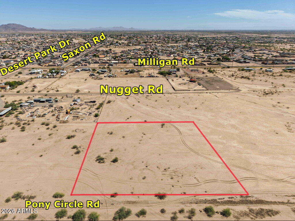 Discover this flat, beautiful vacant lot just south of Arizona City with convenient access to both I-10 and I-8. Located in a rapidly growing area, major employers such as Lucid Motors, Kohler, and other expanding businesses are bringing hundreds of new jobs to the area. The property is close to a paved road and nearby power lines, and sits just one block from established custom-built homes. Zoned GR (General Rural) by the county, this parcel offers flexible use options including site-built, manufactured or mobile homes. Take advantage of this opportunity while prices remain affordable. Boundaries shown in photos are approximate.