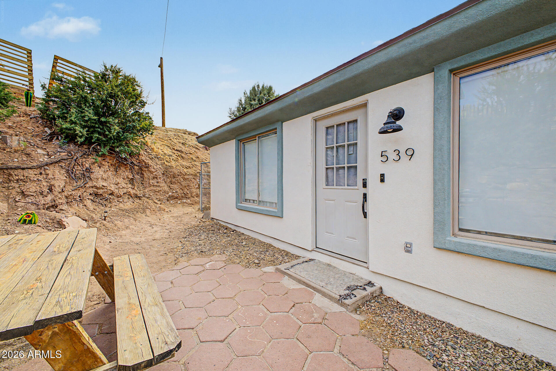 Turnkey investment opportunity in the heart of Wickenburg! This charming 3-bedroom, 2-bath hillside home is currently operating as a successful short-term rental with a strong history of guest appeal. Featuring an inviting open-concept layout, rustic exposed wood beams, abundant natural light, tile flooring, and a warm Arizona charm throughout, this property offers both comfort and functionality. The kitchen includes ample cabinetry and tile countertops, creating a welcoming space for guests & everyday living alike. Conveniently located near local dining, shopping, and Wickenburg's western attractions, this home is ideal for investors seeking an income-producing property, a second home, or a full-time residence with proven rental potential. Don't miss this opportunity to own an established short-term rental in one of Arizona's most charming western communities!