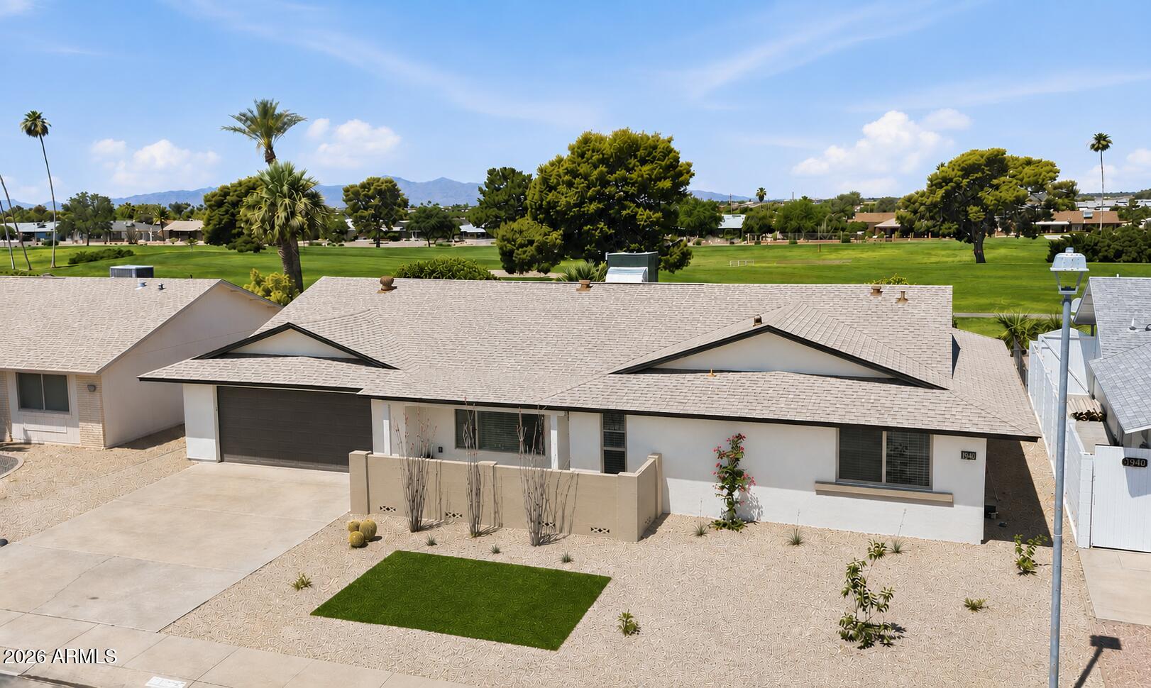 Stunning Golf Course Retreat! This exceptional recent renovation is truly beyond comparison, showcasing a thoughtful blend of functionality, style, and attention to detail! Flowing great room plan w/ fireplace and tile flooring. Open & bright kitchen features quartz counter tops, custom cabinets, KitchenAid appliances, & large island perfect for entertaining. Two primary suites and a powder room, providing space and privacy. Third bedroom can also be utilized as a home office. Custom vanities and tile showers add a touch of elegance.  LED recessed lighting and ceiling fans throughout the home enhance the modern design. Inside laundry w/ cabinets. Stucco exterior, dual pane windows & drs., HVAC-'26, 2 car garage, & golf cart garage. Inviting covered patio to enjoy the views! This is a 10!