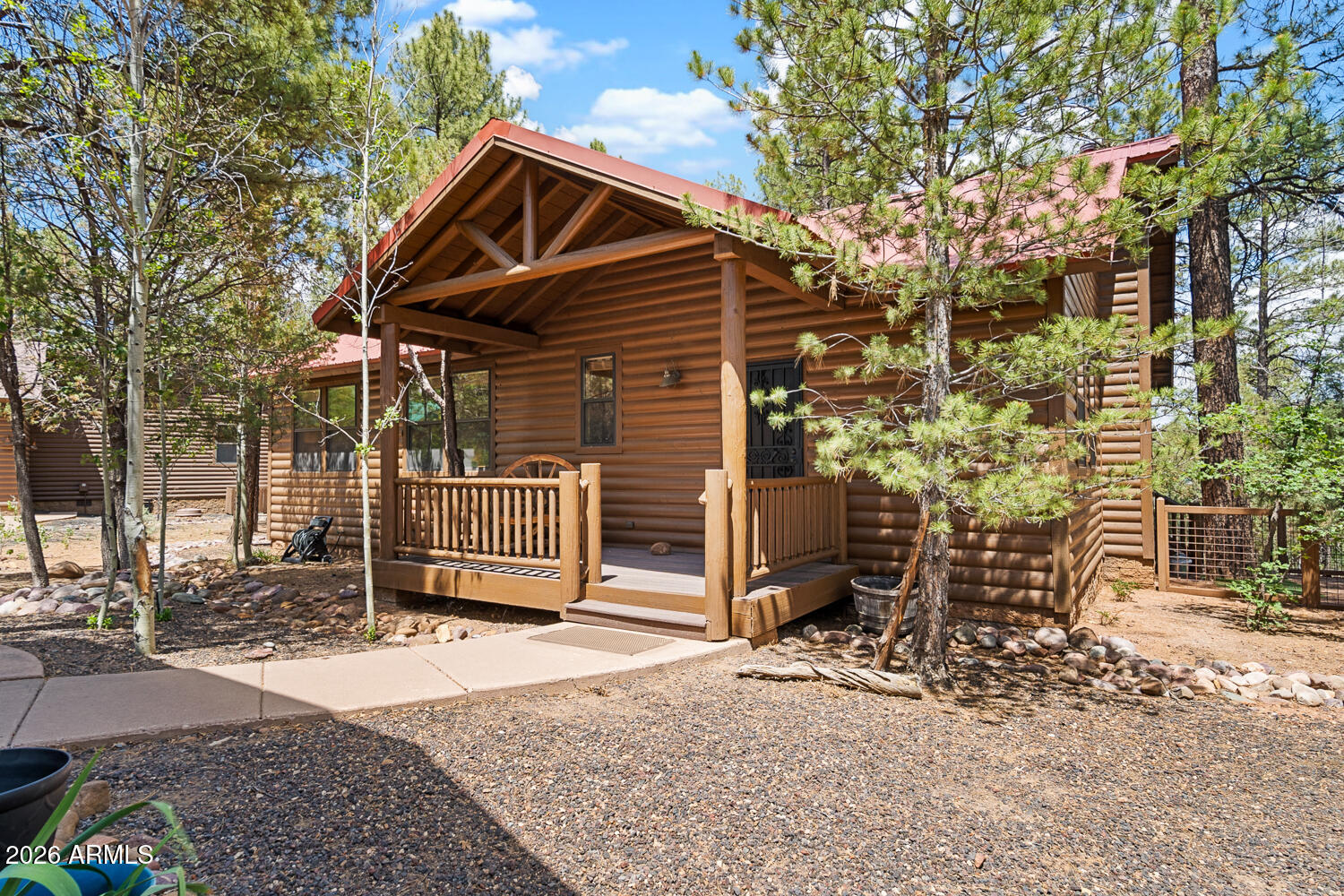 Are you ready to spend your summer in the White Mountains among the ponderosa pine trees in the prestigious community of Torreon with golf, clubhouse, pool/hot tub, pickleball, playground, restaurant and so much more? Here is your opportunity to make your dreams a reality. For only $599,000, you can purchase this beautifully FURNISHED home. Simply bring your clothes, toiletries and food to enjoy a summer of relaxing fun. The floor plan is perfectly laid out, keeping your kitchen/dining and great room open for entertaining. Some of the highlights include vaulted ceilings with T&G, a stone fireplace and large windows to bring the outside in. You'll love your master bedroom with walk-in closet and en-suite bathroom that includes an over-sized, step-in shower. As an added bonus, you have a sliding glass door, that adds a lot of natural light, in your bedroom leading to the back deck. Your 1534sf home has 2 guest bedrooms and an additional bathroom with a tub/shower combination. The detached 2 car garage is extended for larger vehicles or storage/work bench, etc. The owner even installed an EV (electric vehicle) charger in the garage for your convenience. So where do most people want to hang out in the mountains in the summertime, why on your back deck of course! This home has an extensive, covered back deck with a back yard forested with ponderosa pine trees for your privacy. Sit and listen to the wind in the trees and watch the wildlife, especially deer & elk, meander around your house. The current owner has done a lot of work on the home since they bought it in 2022: brand new heat pump with 2 new air vents added and a new return; installed a larger, walk-in shower in master; 2 new toilets; installed low-point water drains to easily drain the home of water in the winter; dog run; drainage landscape rocks for better run-off; stainless steel appliances in the kitchen; motion sensor under-cabinet lights; Maytag dryer; EV charger; 2 fluorescent over-head lights in the garage; and stained the entire exterior of the home (plus re-stained the "sun" walls again). Most everything you see will convey with the home for the right offer. There are still a few personal items in the home and garage that will be removed before closing. We know there are many homes to choose from, but this location in Cardinal Landing at Torreon can't be beat. Come see for yourself.