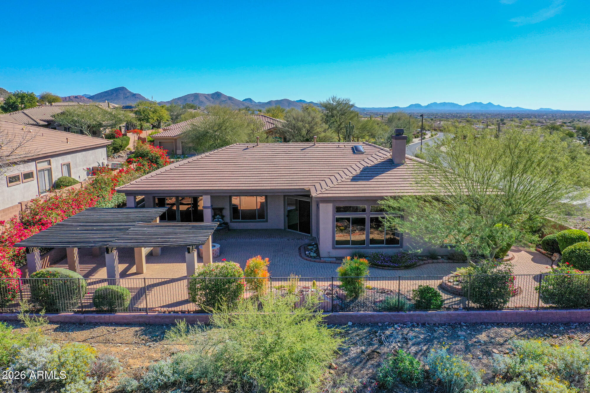 Welcome to a slice of Anthem perfection! This beautifully appointed 4-bedroom, 3.5-bathroom home in Anthem Country Club includes a private guest casita with its own entrance and full bathroom. The serene front courtyard, complete with a soothing fountain, sets the tone for the elegance inside. You'll find neutral tones throughout, accented by 18-inch diagonal tile and textured carpeting.

The kitchen is a chef's dream, featuring a skylight, stainless steel appliances, double ovens, a gas cooktop, granite countertops, raised cabinetry, a breakfast bar, and a spacious walk-in pantry. With a split floor plan offering three additional bedrooms plus a den, you'll have plenty of privacy. MORE Highlights include a Jack and Jill bathroom and built-in garage cabinets. Outside, enjoy stunning views of the desert wash and Daisy Mountain.

As the Tallest REALTOR® in Anthem, I'm here to make sure you find a home that's just right. Feel free to reach out for a personal tour and see why Anthem is truly special.