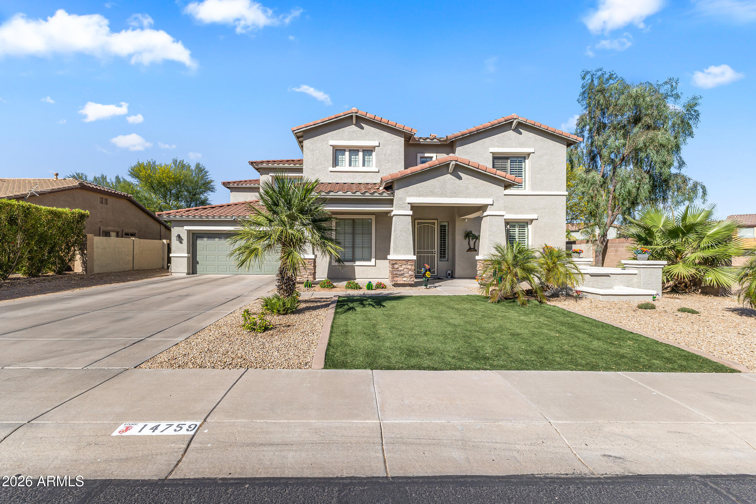 This beautifully upgraded 4-bed, 3.5-bath Surprise home is move-in ready with over $40K in updates! Enjoy plantation shutters, fresh paint inside and out, new carpet, and a kitchen featuring updated countertops and breakfast bar. Cozy up by the fireplace or escape to your backyard oasis with a sparkling pool, custom cover, and low-maintenance artificial turf. Primary suite offers a private ensuite with dual sinks and walk-in closet. New appliances, updated HVAC, A/C'd garage. OWNED Solar Panels! Come see this one today!
