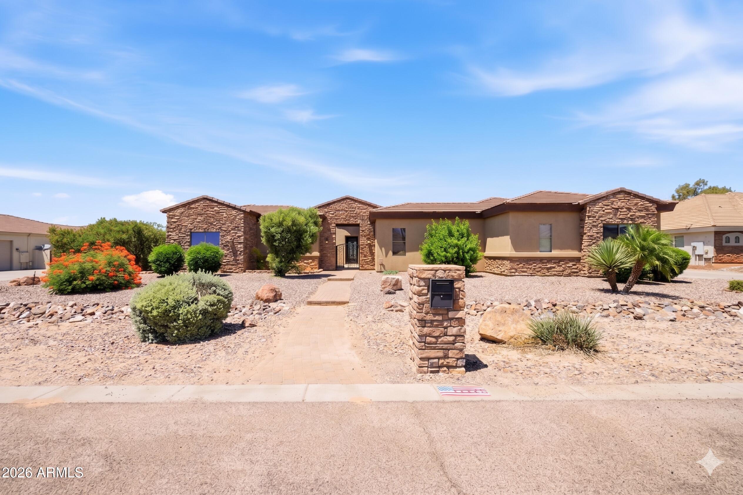 ELEGANT TUSCAN-STYLE CUSTOM RESIDENCE situated on 1.1 acres with stunning views of SanTan mountains! SEPARATE CASITA with bath adjoins charming gated courtyard. LUXURIOUS UPGRADES include travertine tile, alder cabinets, & granite countertops throughout! PLUS stainless steel appliances,12 foot coffered ceilings, french doors & oversized designer windows. Offering lovely curb appeal with a 4-car garage, RV gate, and elegant stone accents. This gem combines space, comfort, and timeless charm. Discover a harmonious open floor plan designed for modern living and effortless entertaining! Relax under the covered patio while sipping your favorite beverage, enjoying peaceful mornings and beautiful Arizona sunsets. This is an entertainer's dream home!