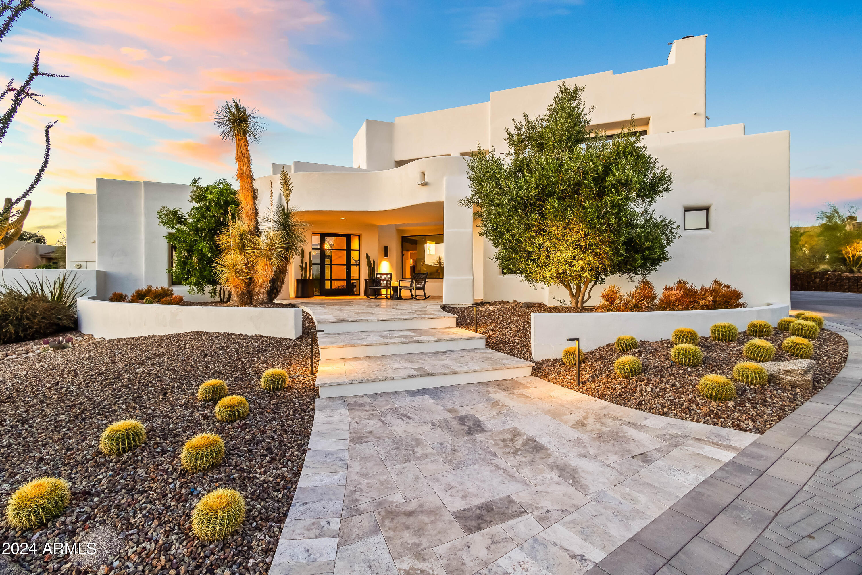 Exceptional 4,300 square foot modern dream home sits on 3/4 acre of beautifully landscaped desert gardens with a luxe resort-style backyard. This prestigious N. Scottsdale modern Mediterranean home is an easy drive to the McDowell Sonoran Preserve, Tom's Thumb Trailhead, and Pinnacle Peak Park, access to the 101 Fwy, Scottsdale Quarter, Kierland, and Promenade restaurants and shopping, and one of the best school districts in the state. With its distinctive architecture and unrivaled attention to detail, the home's open floor plan is ideal for entertaining, inviting the outdoors in. All of the main living spaces have direct access to the outdoor spaces which include a front patio with white travertine stone pavers, outdoor living/ dining with two back patios, outdoor grill, and dramatic exterior Kiva fireplace. The backyard is highlighted by breathtaking sunset views, heated pool with Baja step, poolside seating area; separate spa, white travertine stone pavers, and stunning desert landscape.  

The home includes a welcoming front entry, well-appointed gourmet kitchen overlooking the main living area, 4 bedrooms, 4.5 bathrooms, multiple upstairs balconies/ decks, and 3 car garage with extended RV parking on driveway featuring Herringbone pavers. No HOA!  Additionally, the home boasts all newly remodeled Sierra Pacific windows and doors throughout, Elan home control, automated Somfy window coverings, updated flooring - hardwood and porcelain tile, 90/10 Santa Fe smooth finish walls, Burdette cabinets, remodeled kitchen and bathrooms with Arizona tile, quartz counter tops, updated fixtures, Wolf, SubZero, and Miele appliance package, designer lighting, elevated ceiling heights, and specialty details throughout.   

The primary bedroom suite features a luxurious primary bath, custom cabinetry, quartzite counter tops, beverage cooler, porcelain tile flooring, over-sized shower, soaking tub, and spacious his /her walk-in closet. This is one of the finest properties available on the luxury market!