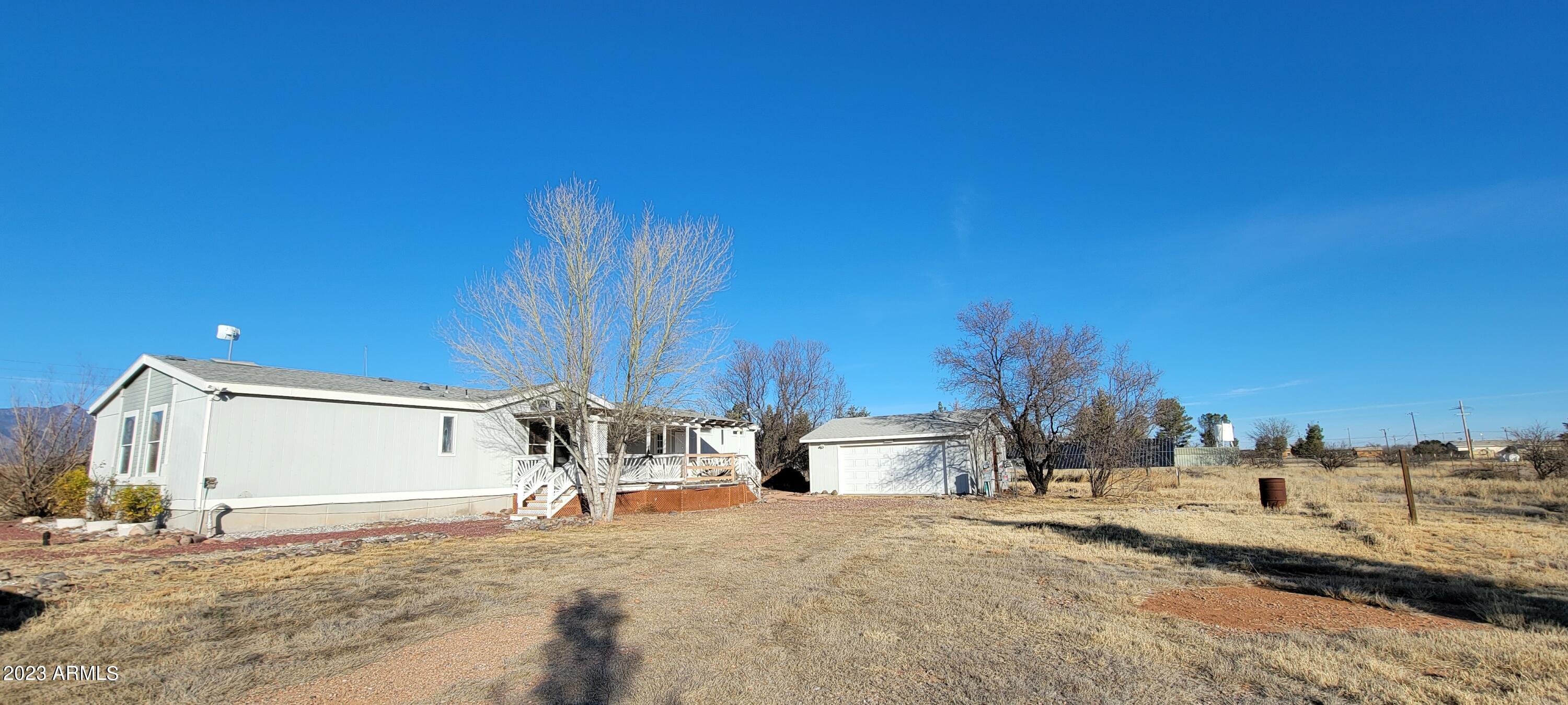 You will not see a better priced home with solar and a 2 car detached garage that has a fenced 4 acre parcel!!! The home has a wonderful floor plan and the covered decks take advantage of the amazing views! There is a huge master suite with a fully handicap accessible bath with a roll in shower, dual sinks plus another sink for hand wash, small pets or ? The secondary bedrooms are on the other end of the home for privacy. There is a lovely formal dining room and a nook off the kitchen. There is a HUGE family room with built ins as well. This home will not last. Seller (Vendee) financing may be available on this property. Please call if you have any questions or for your private showing. This is an AS IS sale.