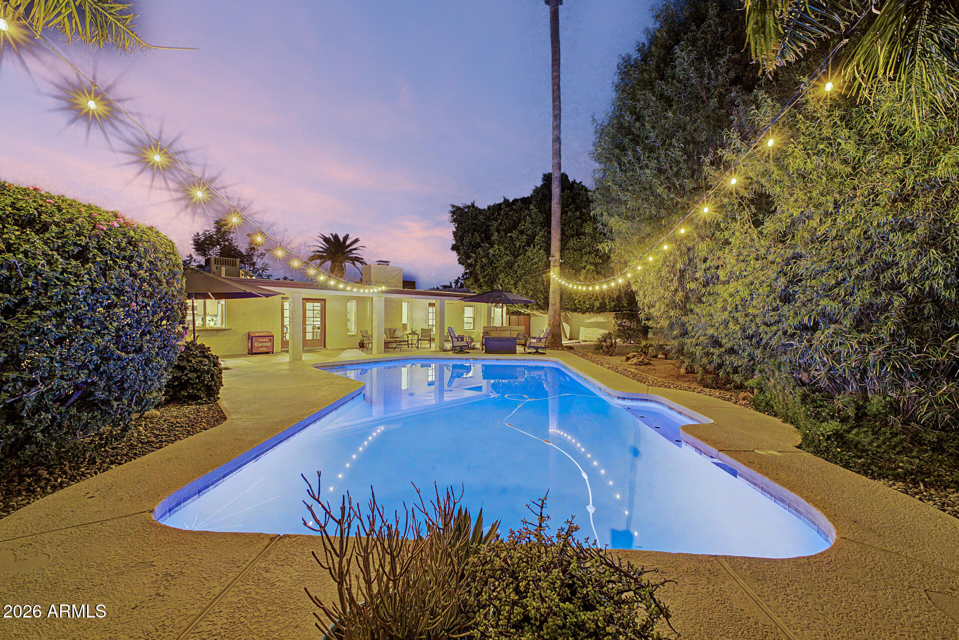 Nestled on a rare 1/3+ acre lot in one of the area's most sought-after locations, this incredible property offers the perfect combination of space, recreation, and convenience! Featuring 4 bedrooms, 2.5 bathrooms, a sparkling diving pool, and over 1,700 sq ft of garage space with room for up to 7 vehicles, this home is truly one of a kind. Enjoy exclusive access to a private sports court shared with only three neighbors, offering tennis, pickleball, and basketball just steps from your backyard. Major updates include newer Trane A/C units (2019 & 2021), water heater (2024), pool pump and filter (2022), and a freshly recoated roof (2026), providing peace of mind for years to come. City water, city sewer, and fiber internet complete the package. Inside, you'll find wood and Saltillo tile flooring, neutral paint, upgraded lighting, skylights, dual-pane windows, ceiling fans throughout, and blackout window coverings in every bedroom. The inviting family room centers around a cozy wood-burning fireplace.

The remodeled kitchen is designed for both everyday living and entertaining with custom dovetail cabinetry, pull-out shelves, granite countertops, stainless steel appliances, multiple pantries, a coffee bar, granite composite sink, and a pass-through serving window to the backyard patio.

The spacious primary suite overlooks the backyard oasis and features a custom walk-in closet with built-in shelving and drawers, updated dual-sink vanity, travertine flooring, a beautifully tiled frameless glass shower, and private access to the patio and pool.

Step outside to your own private resort featuring a large covered patio with ceiling fans and gutters, mature shade trees, lush landscaping, expansive grass yard, outdoor lighting, a sparkling diving pool with variable-speed pump, large grapefruit tree, 12'x12' Tough Shed, 220V wiring for a future spa, and a 9'9" RV gate with 39 feet of concrete parking. The circular driveway accommodates approximately 10 vehicles, making entertaining easy.

Car enthusiasts, hobbyists, and business owners will love the massive 7-car garage with finished concrete floors, tall ceilings that may accommodate vehicle lifts, abundant cabinetry, skylights, air compressor with plumbed air lines, numerous outlets, subpanel, and a separate air-conditioned flex room complete with sink and cabinets--ideal for a workshop, home office, pool house, craft room, gym, or potential guest quarters.

The location is equally impressive. Walk to top-rated schools, parks, shopping, restaurants, and entertainment. Arrowhead Towne Center, Costco, Sam's Club, Target, Walmart, and hundreds of additional stores are within a mile. Enjoy P83 entertainment district, the Peoria Sports Complex, multiple golf courses, New River Trail's 50+ miles of walking and biking paths, nearby hiking, fitness centers, and easy Loop 101 access. This is a rare opportunity to own a home that offers an exceptional lifestyle both inside and out.
