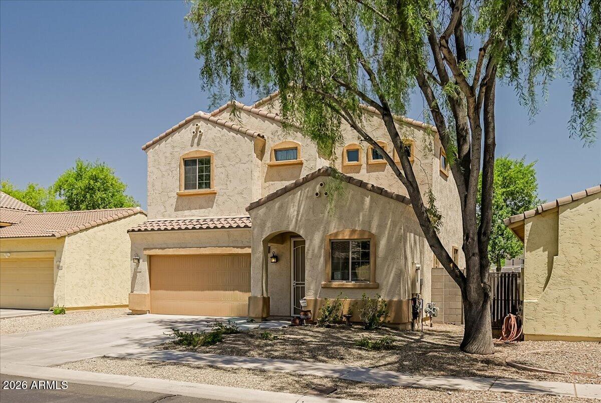 Welcome to this beautifully maintained home in a desirable gated Glendale community. Offering 2,020 sq ft of thoughtfully designed living space, this home features 4 bedrooms, 2.5 bathrooms, and a versatile upstairs loft. The open-concept floor plan provides comfortable everyday living and entertaining. The spacious kitchen features a gas range, center island, breakfast bar, and overlooks the living and dining areas. The first floor includes a guest powder room and a bonus room/bedroom ideal for guests or a home office. Upstairs you'll find three additional bedrooms, including a spacious primary suite with a garden tub, separate shower, and oversized walk-in closet. An upstairs laundry room adds convenience to this functional floor plan. Bedrooms 2 & 3 have the jack & jill bath with double vanity sinks. Bedroom 2 has a walkin closet. Direct access from the garage into the home, ceiling fans throughout out, walkin pantry, & a low maintance back yard with a covered patio, Enjoy the security and amenities of a gated neighborhood while being conveniently located near shopping, dining, schools, parks, and easy freeway access. The community has a playground, pool & spa, plus a workout center. This move-in-ready home combines space, functionality, and location, making it an exceptional opportunity in Glendale.