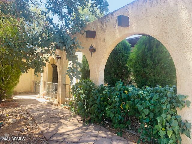 Located in one of the most desirable areas in Sierra Vista, very close to Ramsey Canyon.  1.58 acres of private land with your own private sparkling pool.  This home offers 4 bedrooms, 2 bath with a large kitchen, breakfast nook and formal dining room, large living room with a fireplace and wet bar, large laundry room, a 2 car detached garage and a good size workshop.  The home needs updating and it is sold as-is condition.  Seller won't do any repairs.