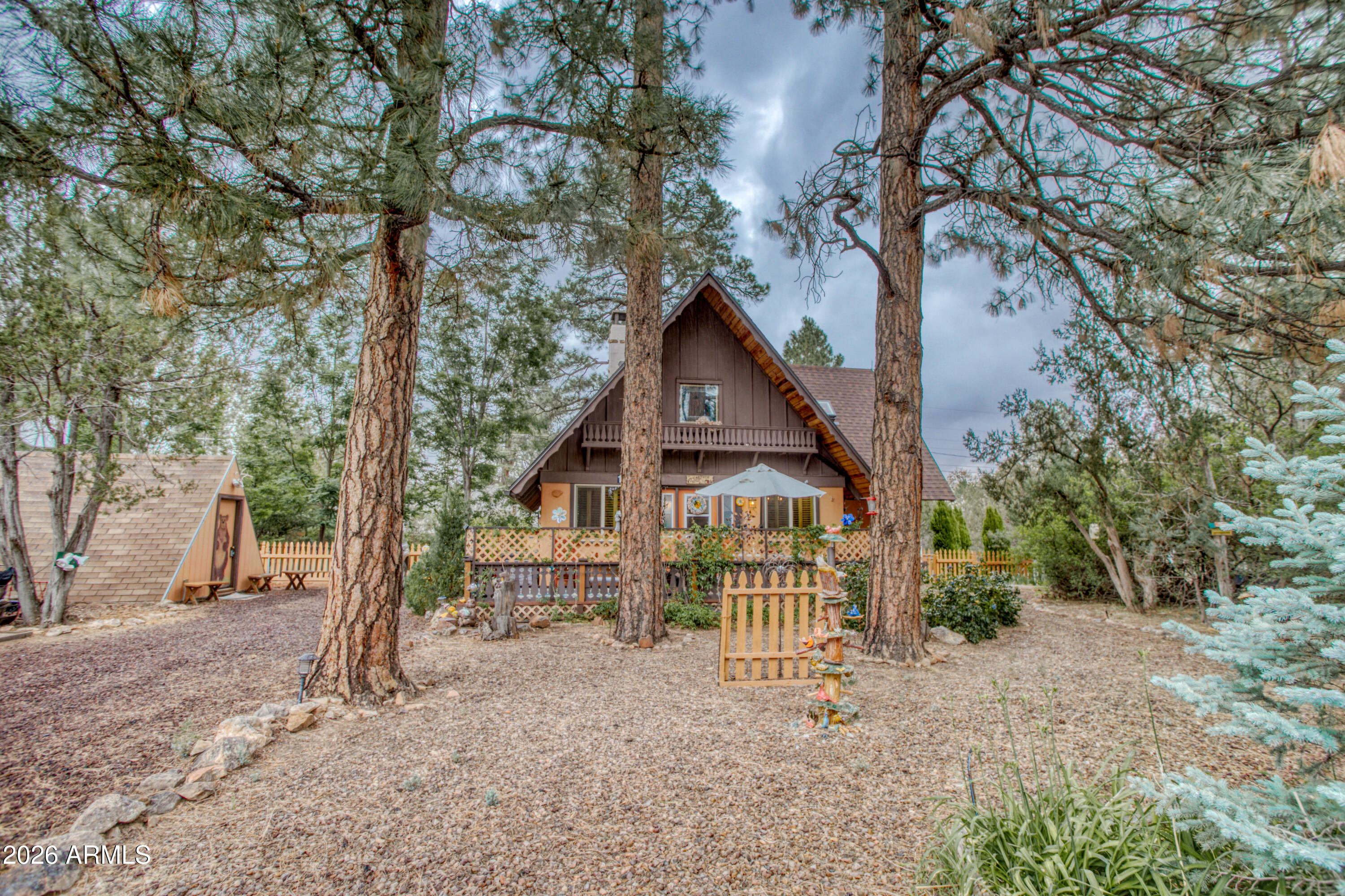 Escape to the cool pines in this charming forest cottage filled with character and mountain charm. Nestled on a spacious 1/3 acre lot, this well-maintained retreat is the perfect getaway for weekends, summers, or year-round living. Energy efficient Pella windows, a newer shingle roof, and an energy-efficient mini-split HVAC system, providing comfort and peace of mind. The home is being offered fully furnished and turnkey--just bring your personal belongings and start enjoying mountain life. Surrounded by towering trees and plenty of outdoor space, this inviting property offers the ideal blend of rustic charm and modern convenience.