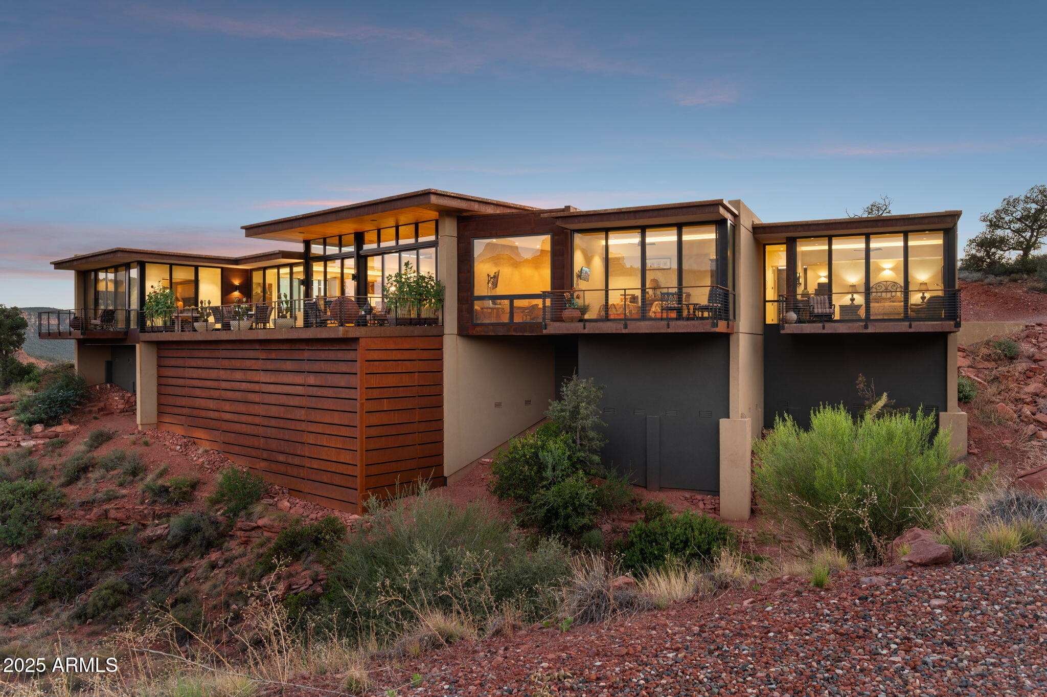 Unmatched, Protected Cathedral Rock Views. Modern Sedona Masterpiece Experience Sedona the way it was meant to be seen—front and center, with jaw-dropping, unobstructed views of Cathedral Rock that will never be compromised. This custom modern estate sits in a premier elevated position, capturing some of the most iconic red-rock panoramas in all of Northern Arizona. At this price point, nothing comes close. Designed to pull the outside in, the home features floor-to-ceiling glass walls that frame Sedona's legendary landscape from every major space. A dramatic pivoting iron door sets the tone, opening to soaring tongue-and-groove cedar ceilings, warm stone accents, and a sleek eco-smart fire feature that anchors the great room. Natural light pours in, highlighting clean architectural lines and an effortless indoor-outdoor flow.
Step onto the expansive terrace and you'll understand instantlythis is a once-in-a-lifetime vantage point. Whether it's sunrise lighting up the formations, or golden hour washing the cliffs in color, your backdrop is nothing short of spectacular.
Multiple outdoor living spaces make this home ideal for entertaining, relaxing, or simply taking in the silence and beauty of the desert. Inside, the open layout blends luxury with livability, offering a space that feels both elevated and welcoming.
If views matterand in Sedona, they always doyou won't find a stronger combination of location, design, and protected sightlines. This is where modern architecture meets the very best scenery Sedona offers.