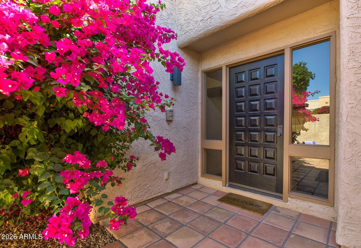 Welcome to this beautiful and newly renovated, modern, yet comfortable townhome, nestled in the heart of Scottsdale. Ensuring both luxury and tranquility, this property is in the coveted Casa del Monte neighborhood, a 24/7 guard-gated community. There's a feeling of calm and serenity when you enter this home. The open floor plan is flooded with natural light throughout, with its large windows and sliding glass doors that seamlessly connect you to the outdoors. The well-equipped kitchen has custom cabinetry, stainless steel appliances, wine fridge and spacious island. The elegant primary suite is downstairs and has sliding doors to backyard, a stylish en-suite and walk-in closet. Upstairs are two guest bedrooms and bathroom with designer finishes. The inviting backyard has plenty of spaces to dine, relax and enjoy the outdoors. This prime Scottsdale location is within walking distance to Scottsdale Fashion Square, Old Town, Phoenician, and hiking at Camelback Mountain. Casa del Monte residents enjoy amazing amenities: 3 pools, spa, clubhouse, fitness center, tennis/pickleball and basketball courts.